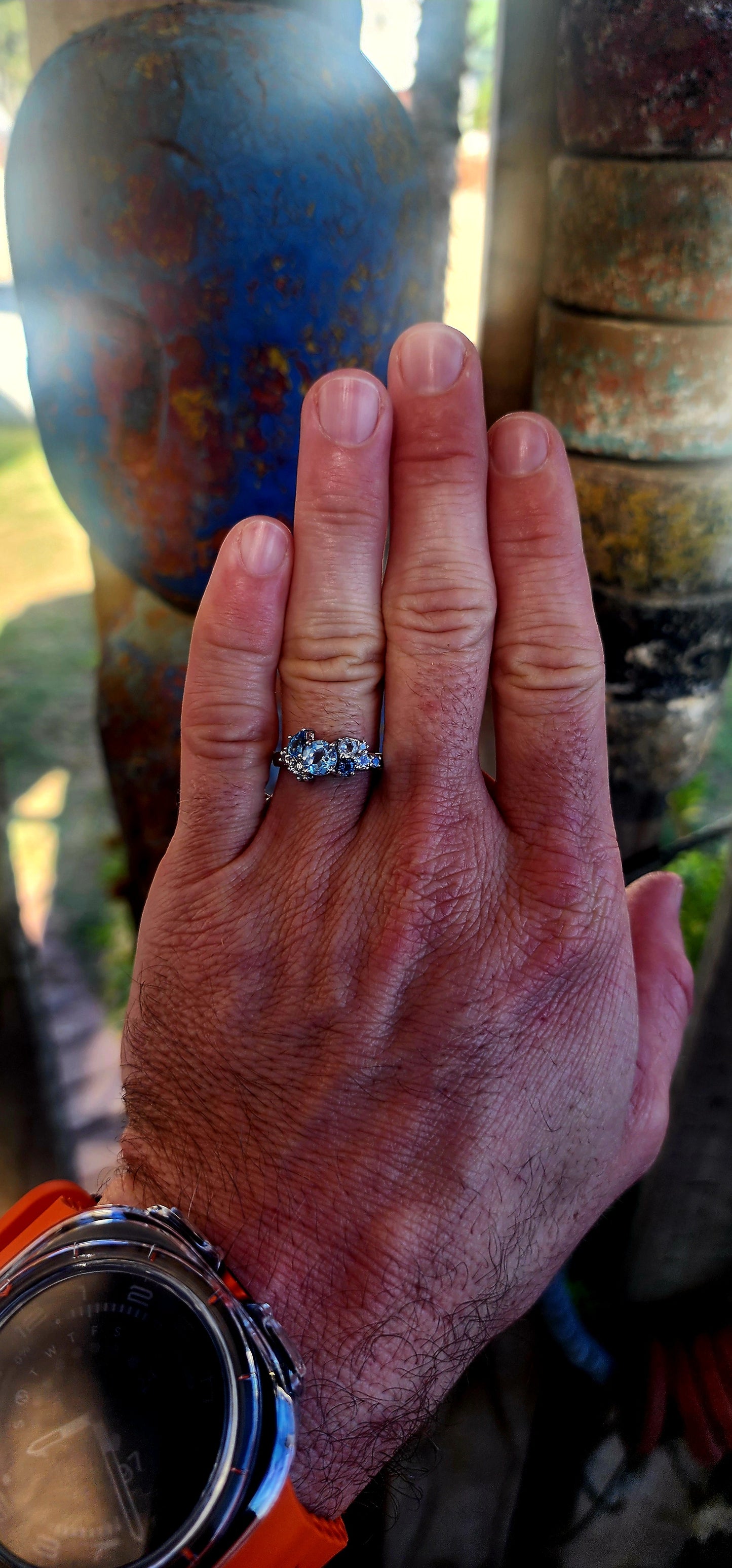 Crafted in solid sterling silver and finished with rhodium plating for a bright, tarnish-resistant white-gold look, this ring is a tribute to the beauty of topaz in all its shades of blue.