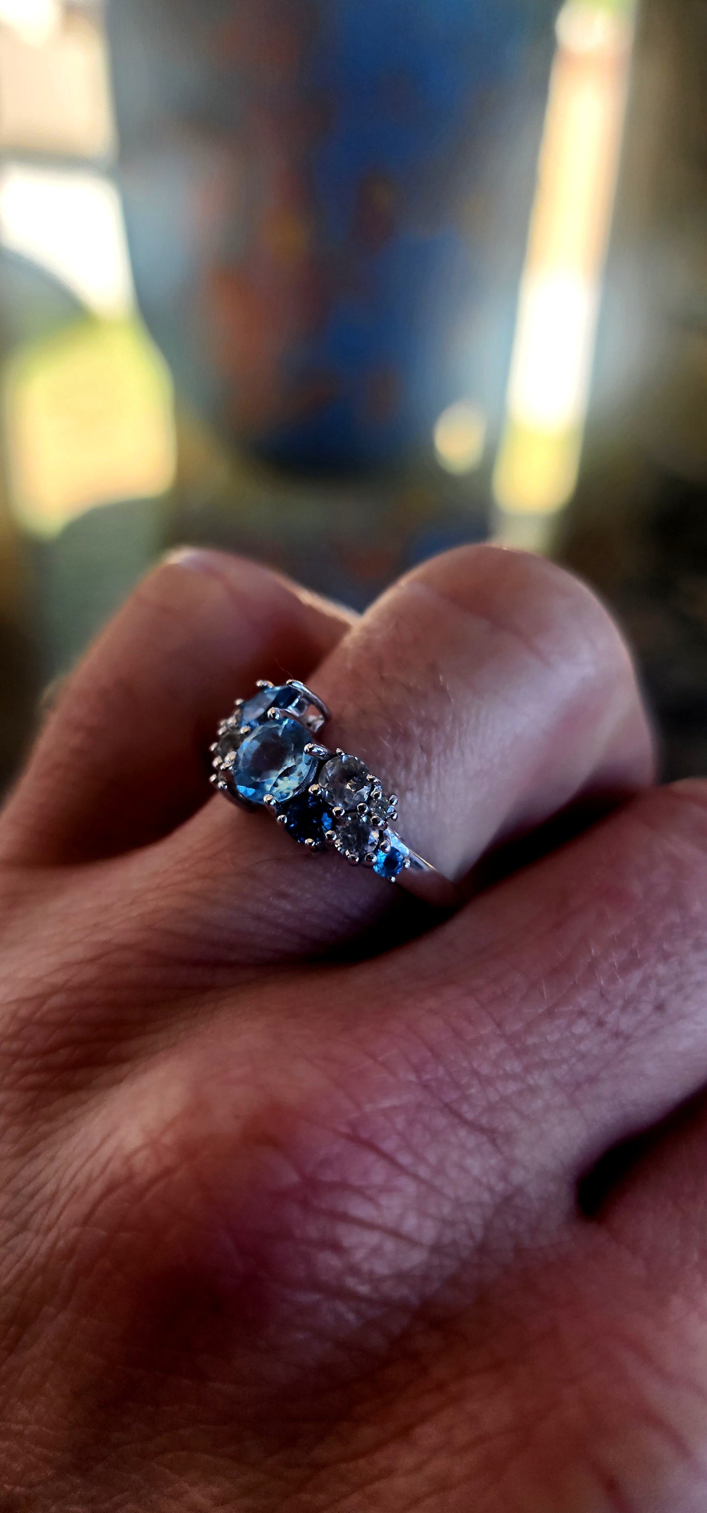 Crafted in solid sterling silver and finished with rhodium plating for a bright, tarnish-resistant white-gold look, this ring is a tribute to the beauty of topaz in all its shades of blue.