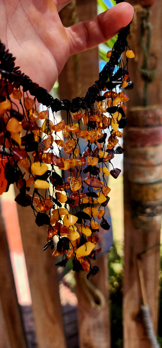 Handmade and gloriously bold, this chunky statement piece is crafted from natural Baltic amber chips.