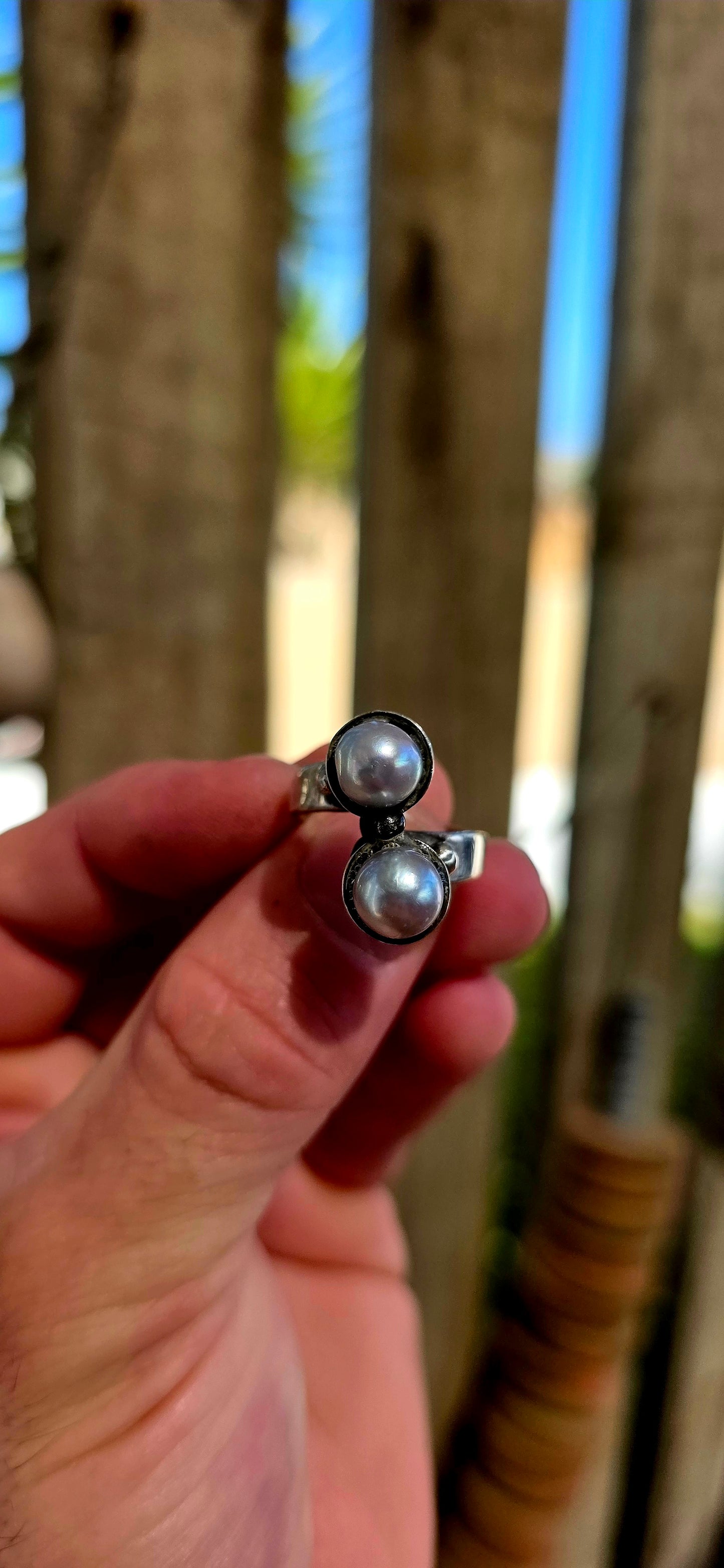 This striking circa 1970’s modernist artisan-made set consists of a sculptural Toi et Moi cross-over ring and matching clip-on earrings, all crafted in sterling silver and signed by the artist.