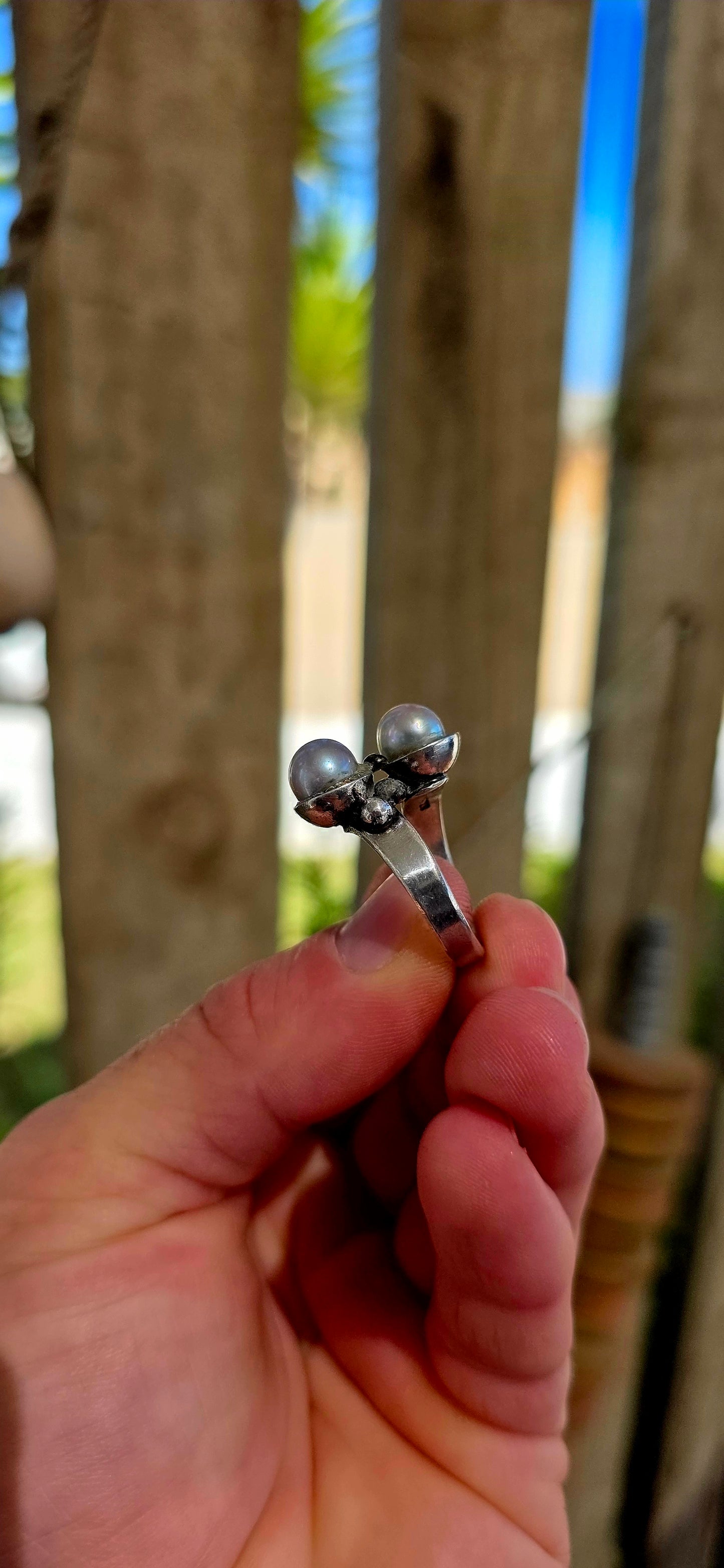 This striking circa 1970’s modernist artisan-made set consists of a sculptural Toi et Moi cross-over ring and matching clip-on earrings, all crafted in sterling silver and signed by the artist.