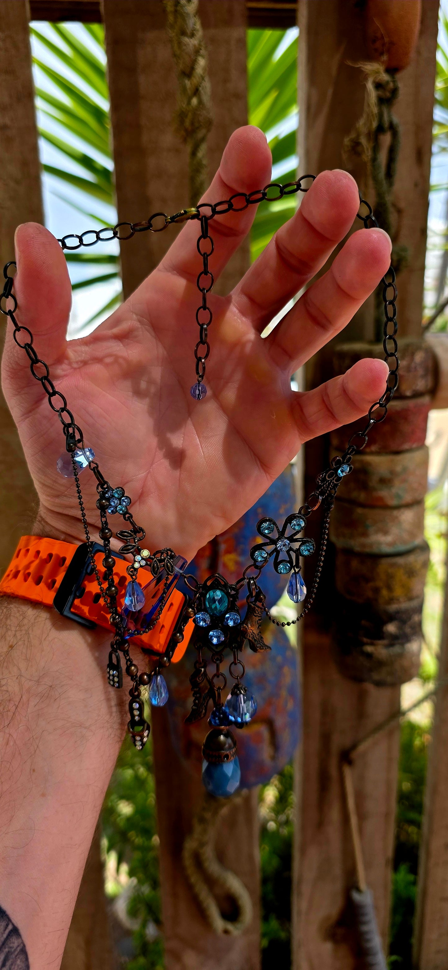 This fabulous designer costume necklace is crafted in an antique bronze-tone metal, giving it a warm, slightly vintage patina — the perfect backdrop for all those luminous blue rhinestones.