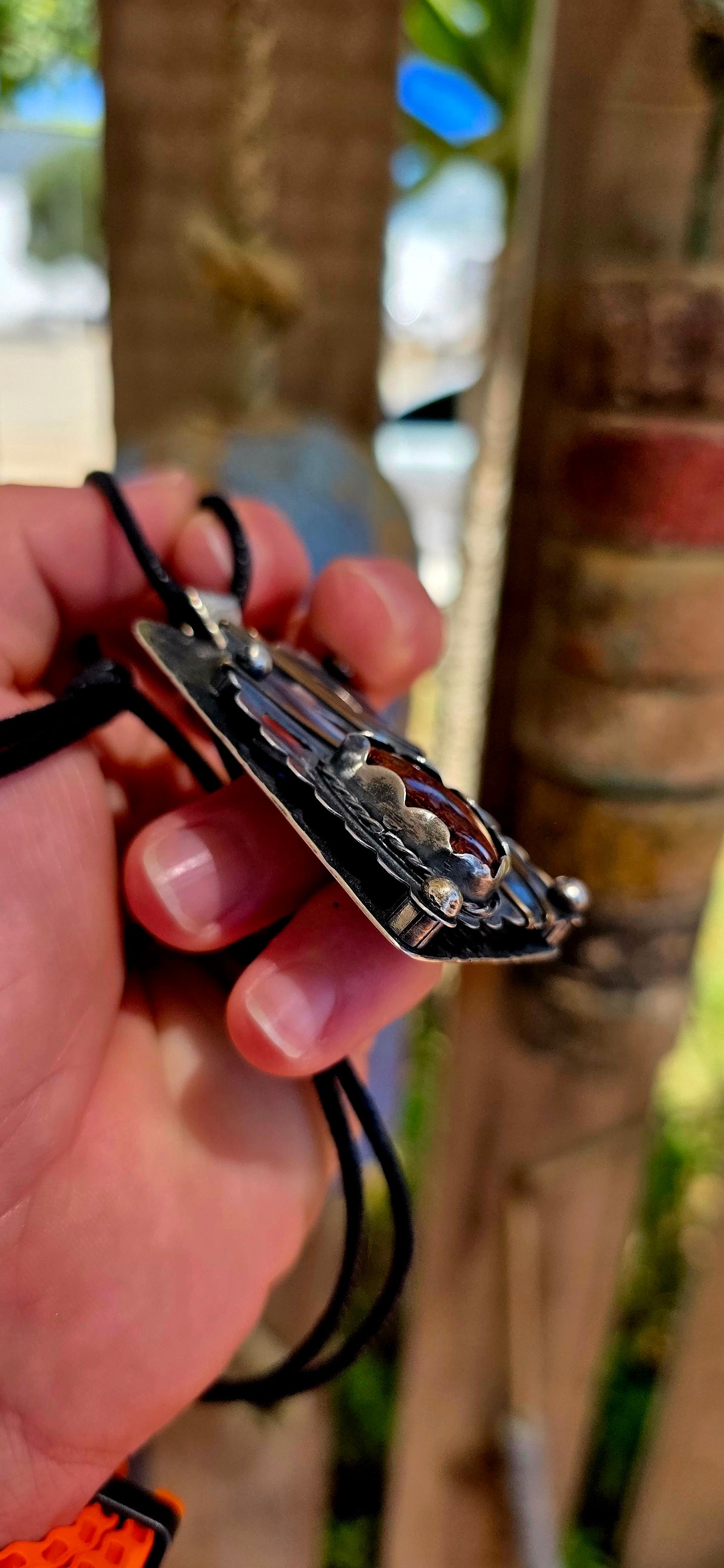 This large-scale artisan-made pendant is crafted in solid sterling silver and designed in a bold rectangular form with strong dimensional presence.