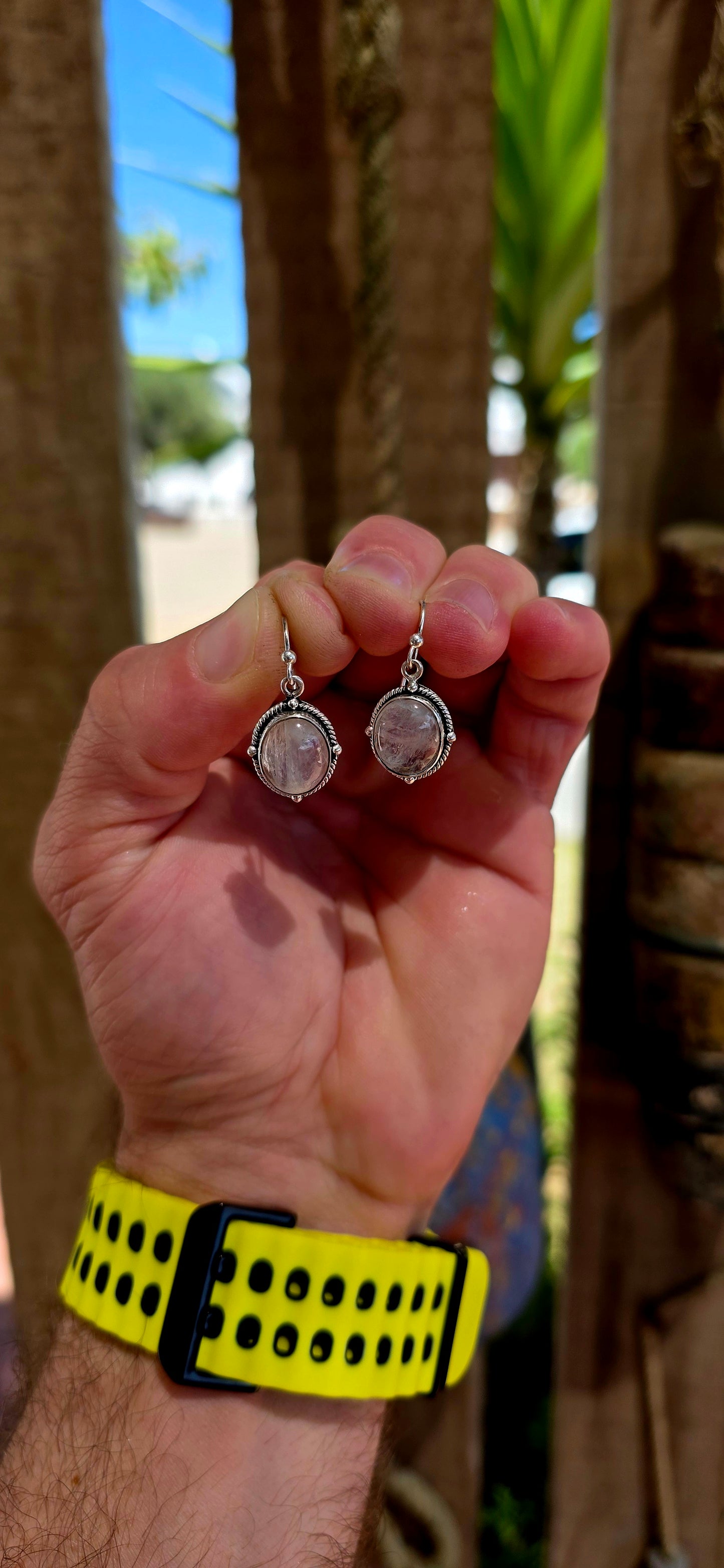 This beautiful pair of bohemian dangle earrings is crafted in solid sterling silver and set with glowing oval moonstone cabochons.