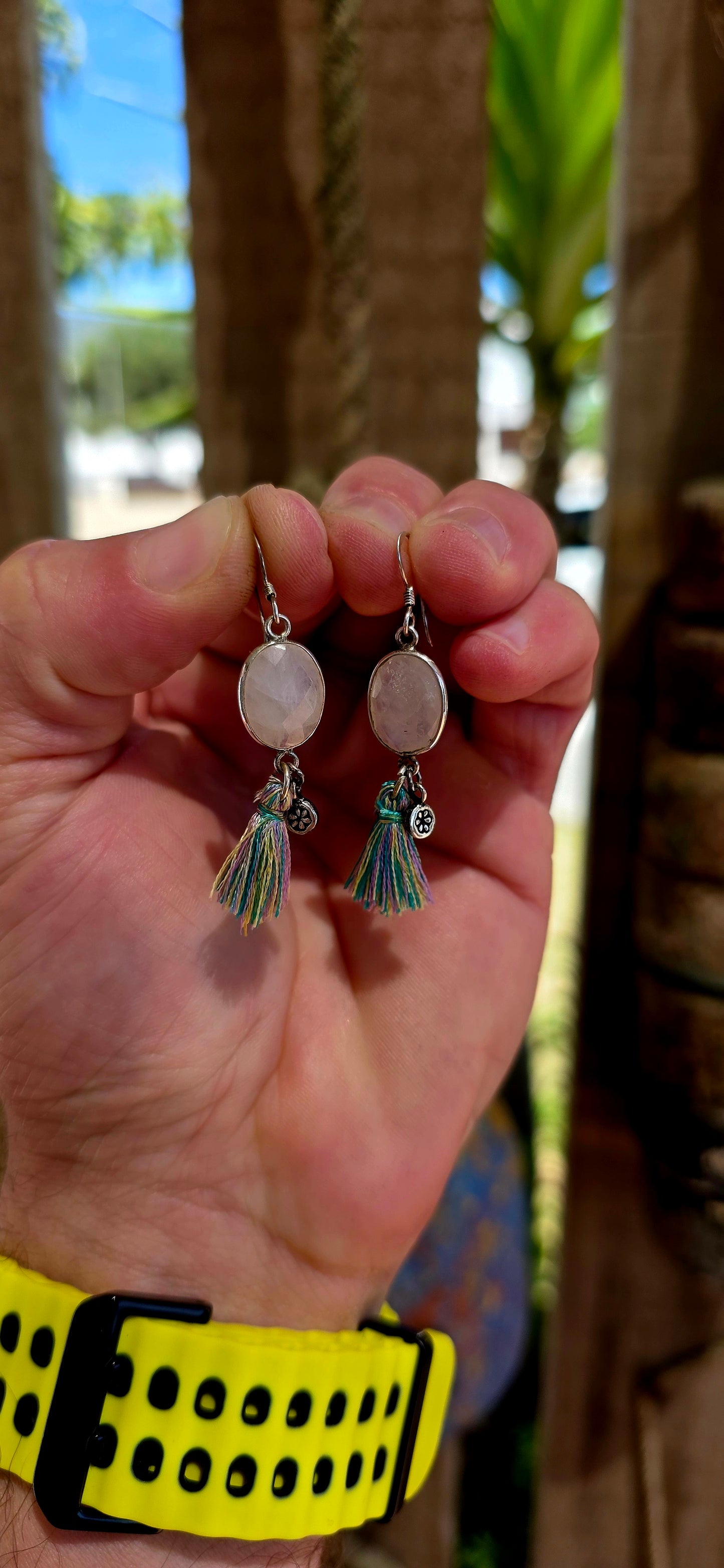 This beautiful pair of bohemian drop earrings is crafted in sterling silver and features oval faceted moonstone gemstones, securely tube-set within smooth silver frames.