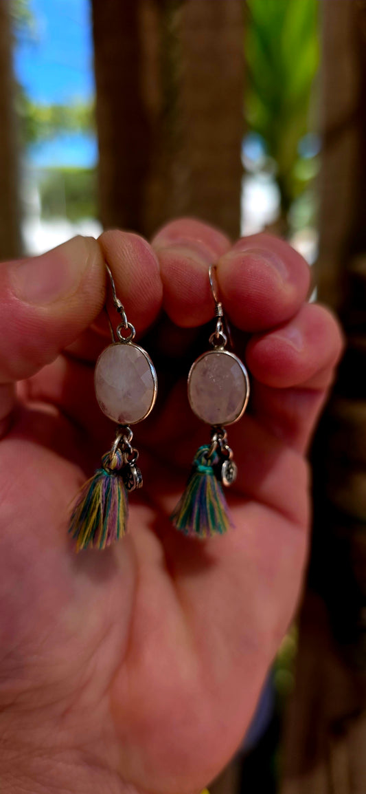 This beautiful pair of bohemian drop earrings is crafted in sterling silver and features oval faceted moonstone gemstones, securely tube-set within smooth silver frames.
