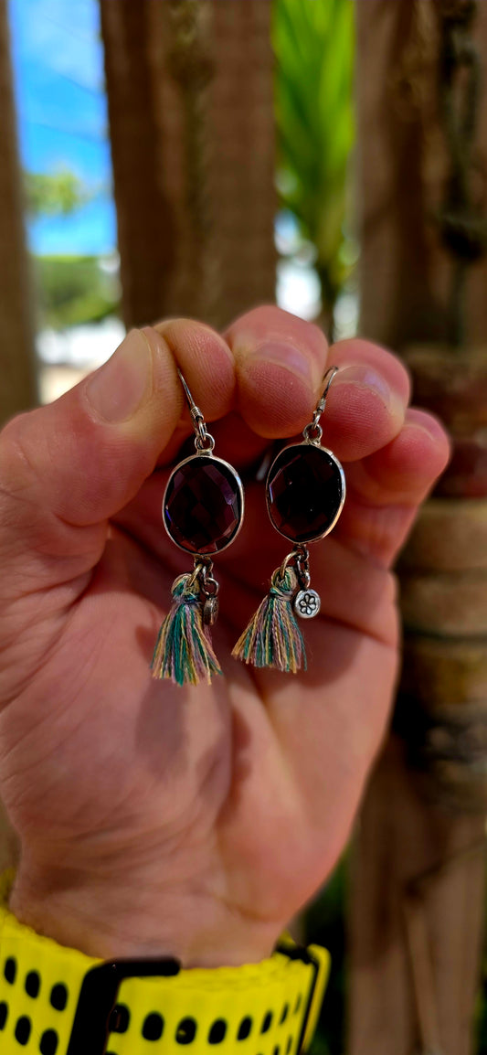 This beautiful bohemian pair is crafted in sterling silver and features oval faceted amethyst gemstones, securely tube-set in smooth silver frame.