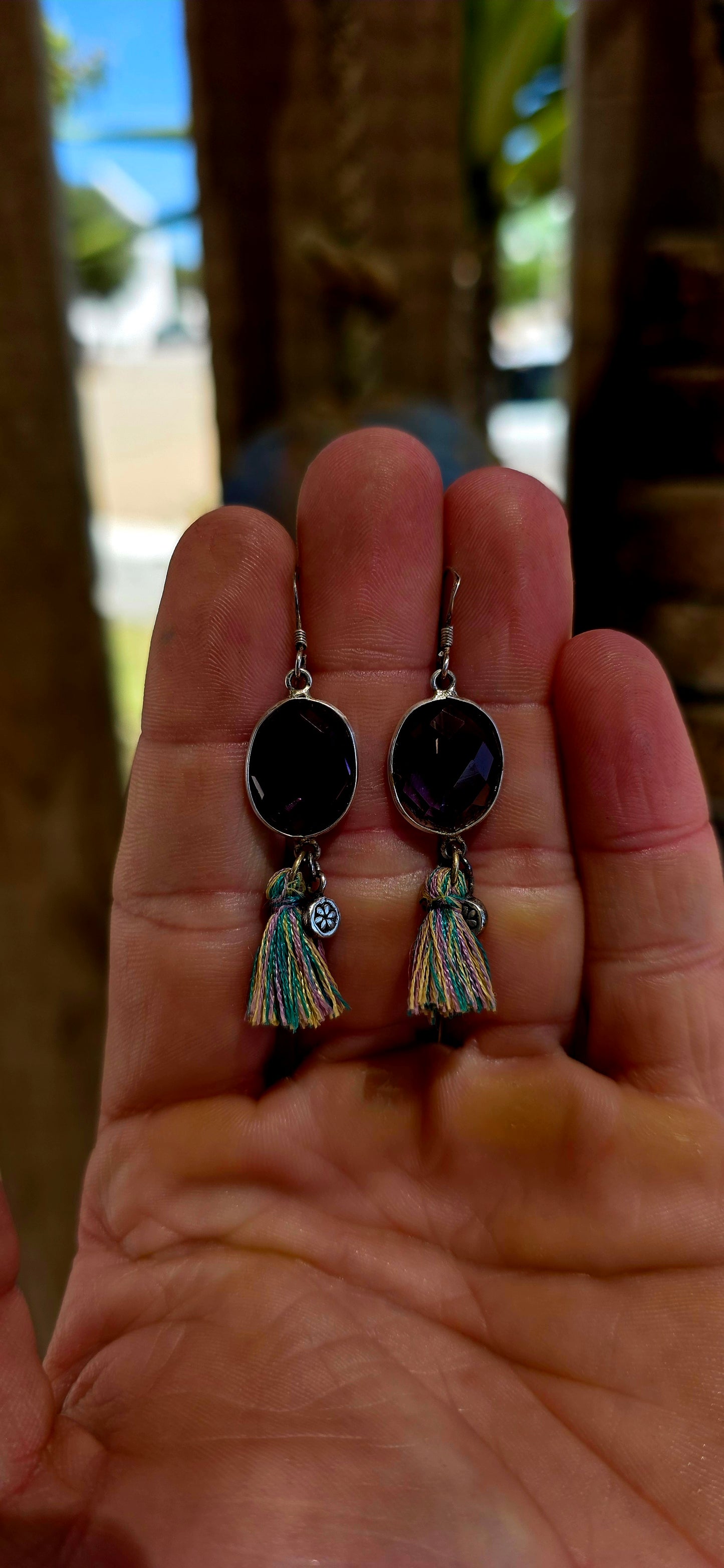 This beautiful bohemian pair is crafted in sterling silver and features oval faceted amethyst gemstones, securely tube-set in smooth silver frame.