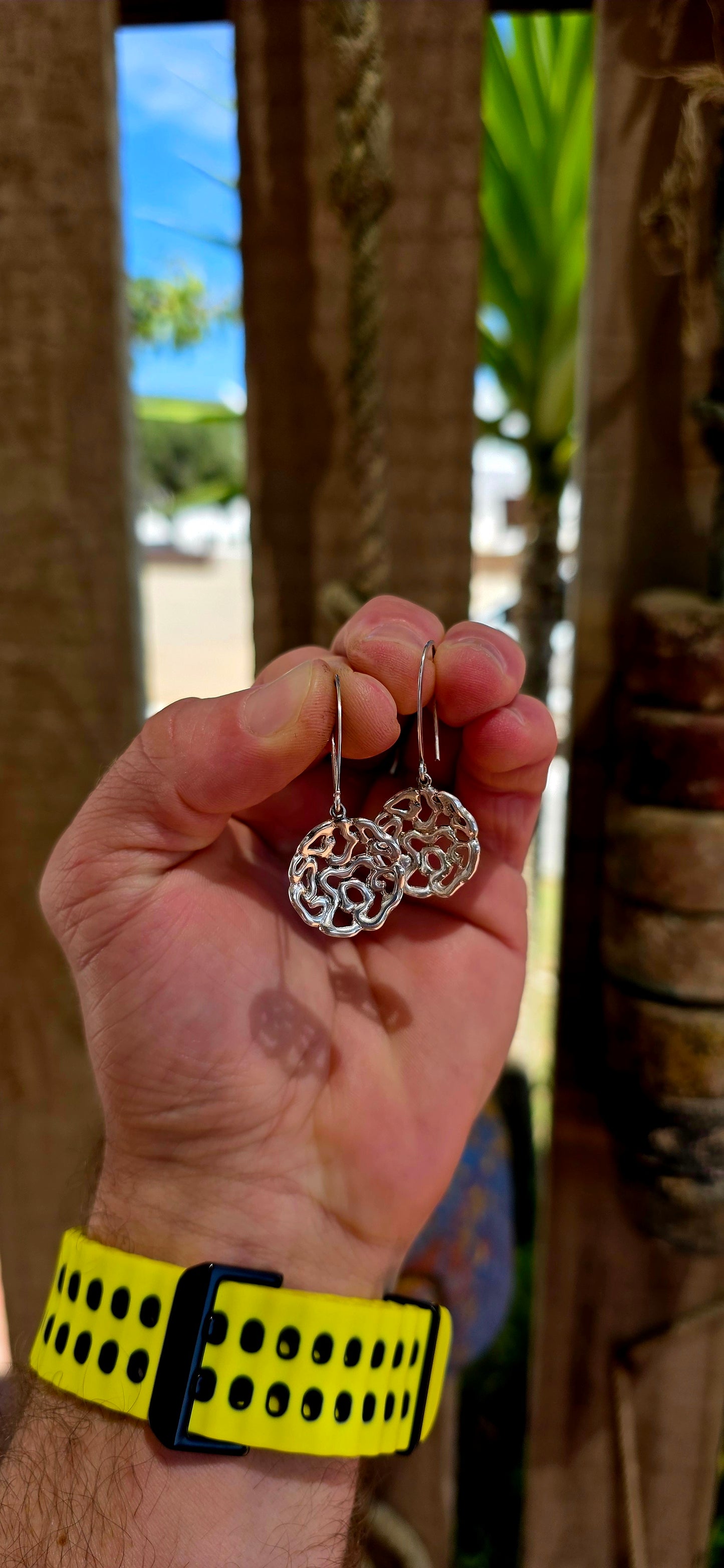 This striking pair of artisan-made earrings is crafted in solid sterling silver and designed in an abstract floral-inspired form — but not your traditional flower.