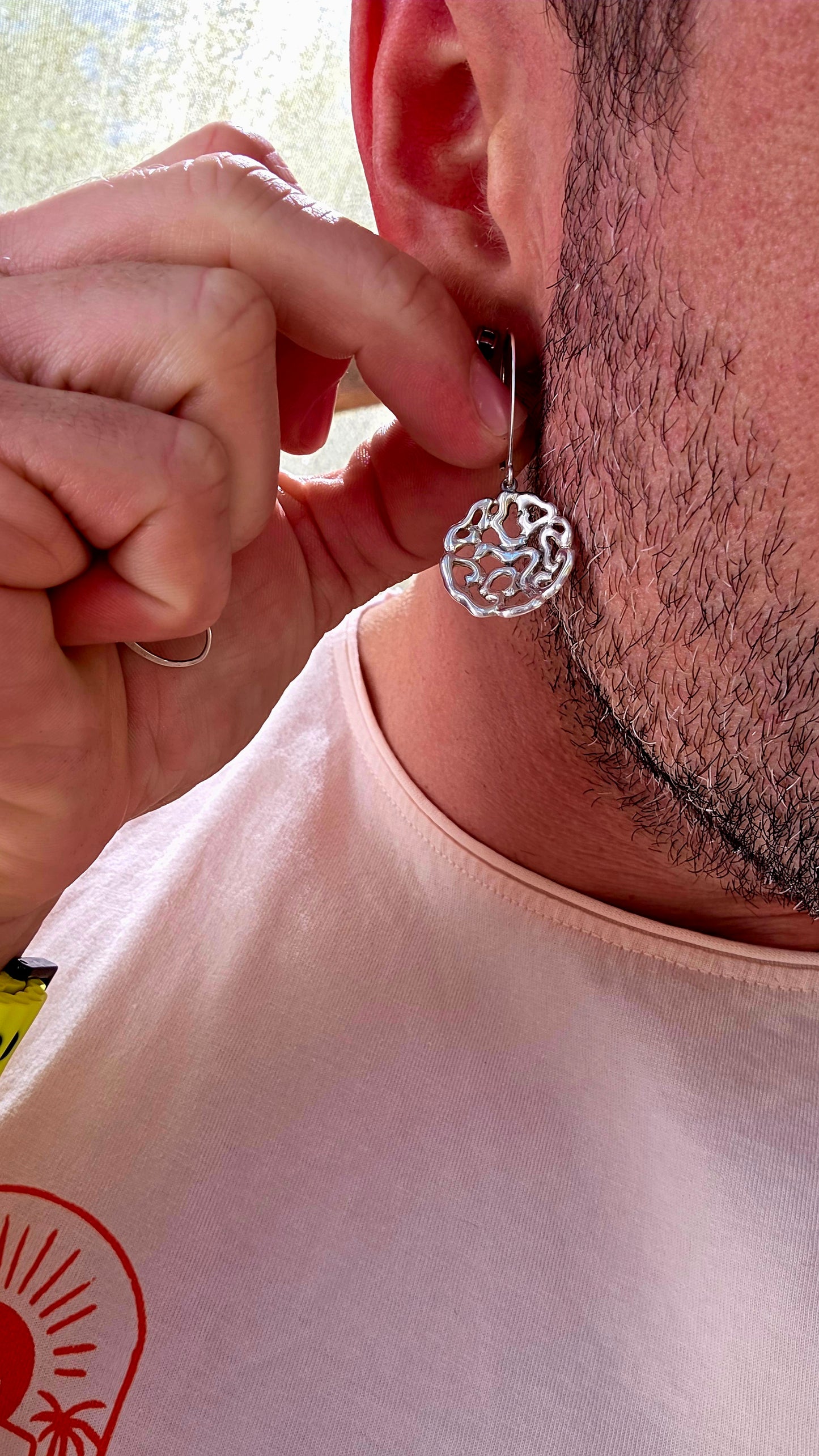This striking pair of artisan-made earrings is crafted in solid sterling silver and designed in an abstract floral-inspired form — but not your traditional flower.