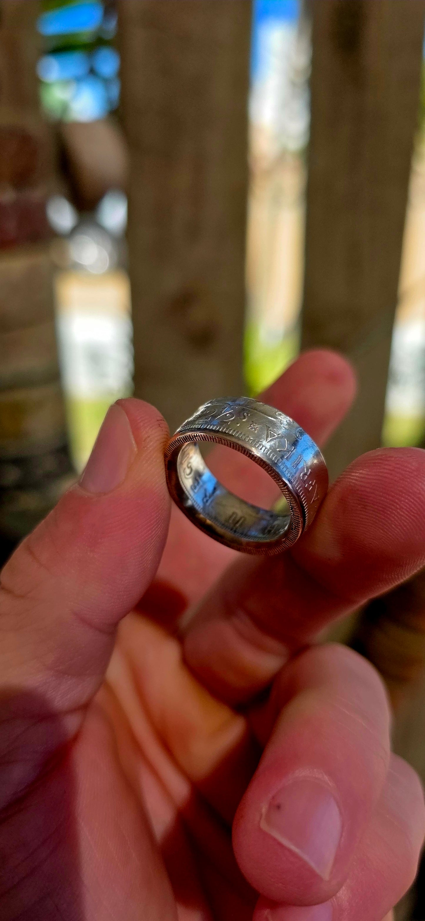 This fantastic artisan-made coin ring has been crafted from an authentic South African 2½ Shilling coin dated 1956, struck in .500 silver during the Union of South Africa era.