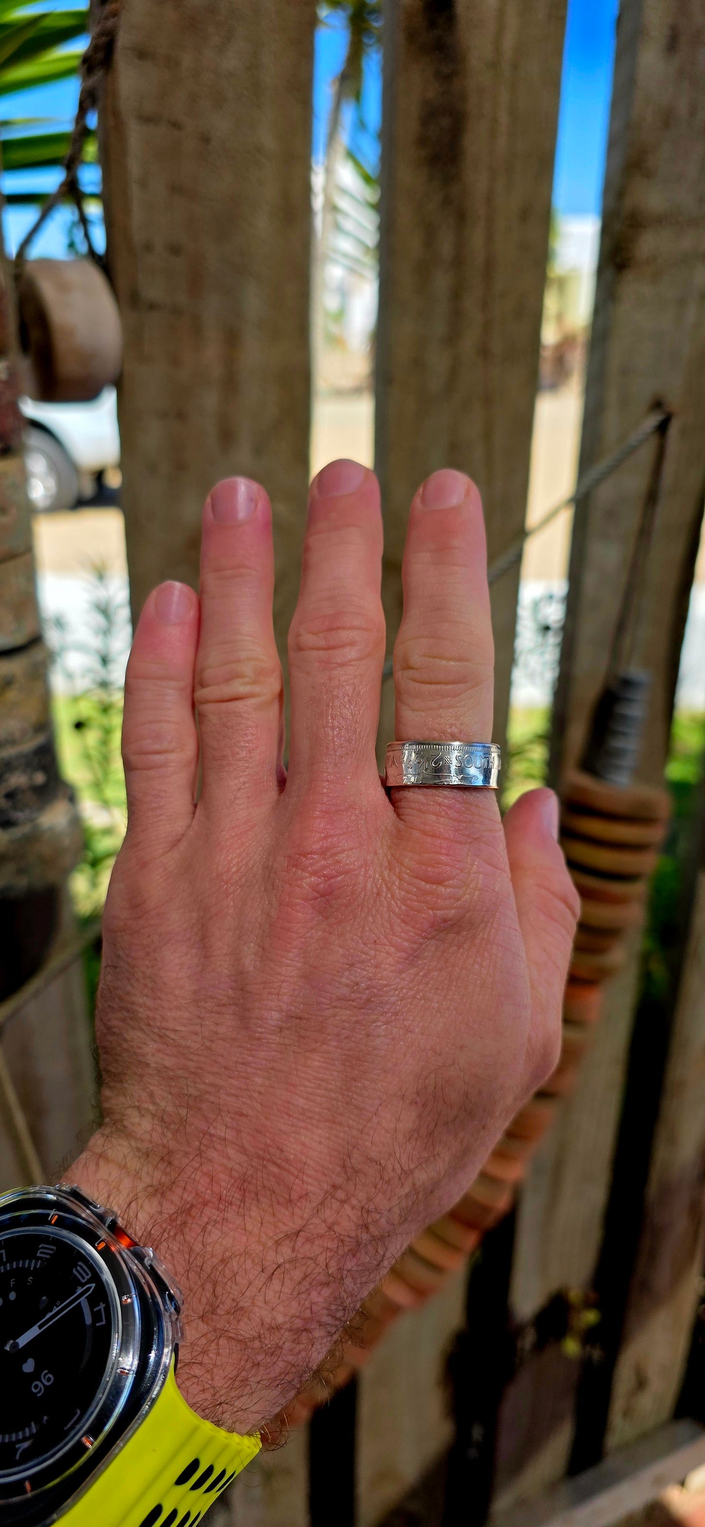 This fantastic artisan-made coin ring has been crafted from an authentic South African 2½ Shilling coin dated 1956, struck in .500 silver during the Union of South Africa era.