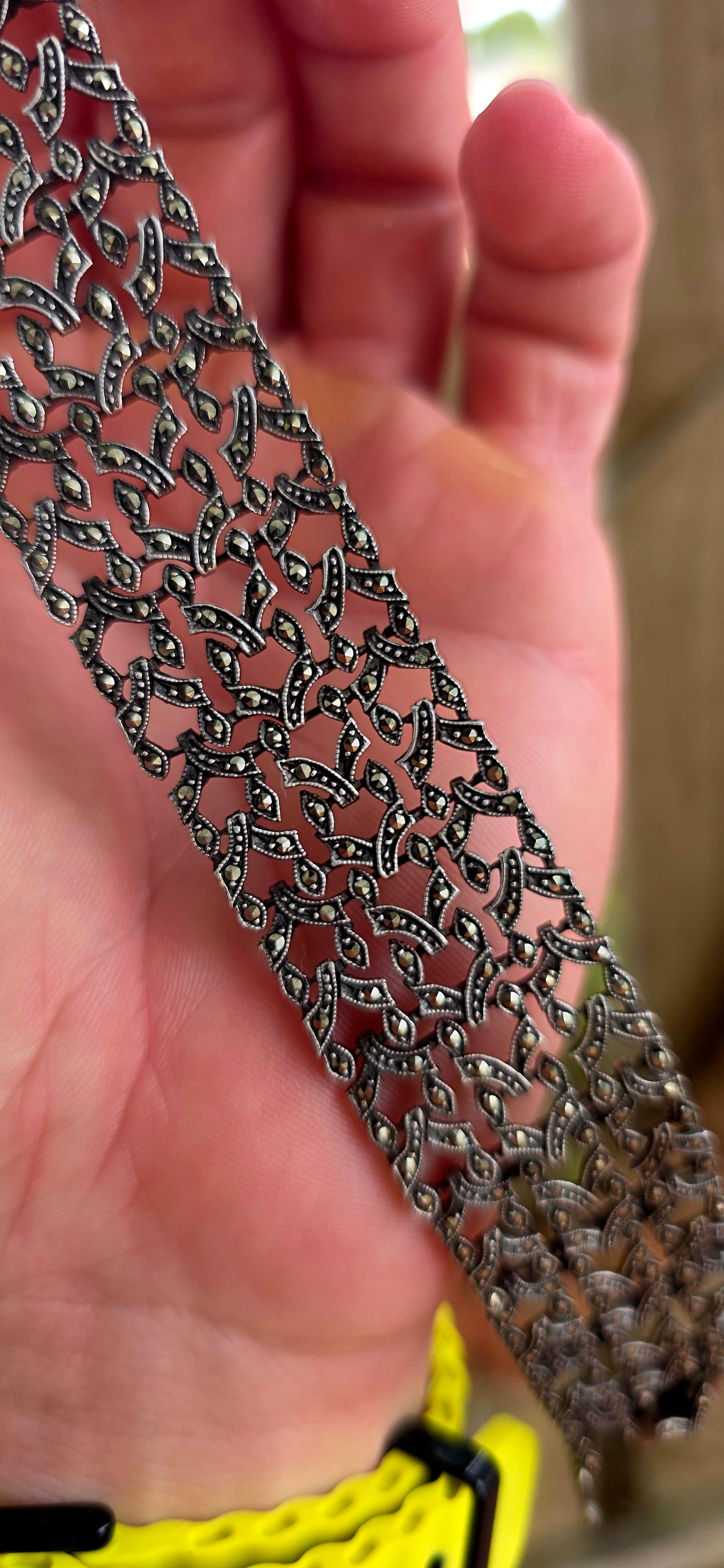 A marvellous and exceptionally beautiful antique bracelet dating to the glamorous Art Deco era, circa 1920’s, crafted in solid sterling silver and richly decorated with shimmering prong-set marcasites.