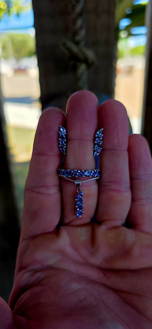 This beautiful matching sterling silver jewellery set brings together the soft, captivating glow of tanzanite gemstones in a coordinated trio designed to complement one another perfectly.