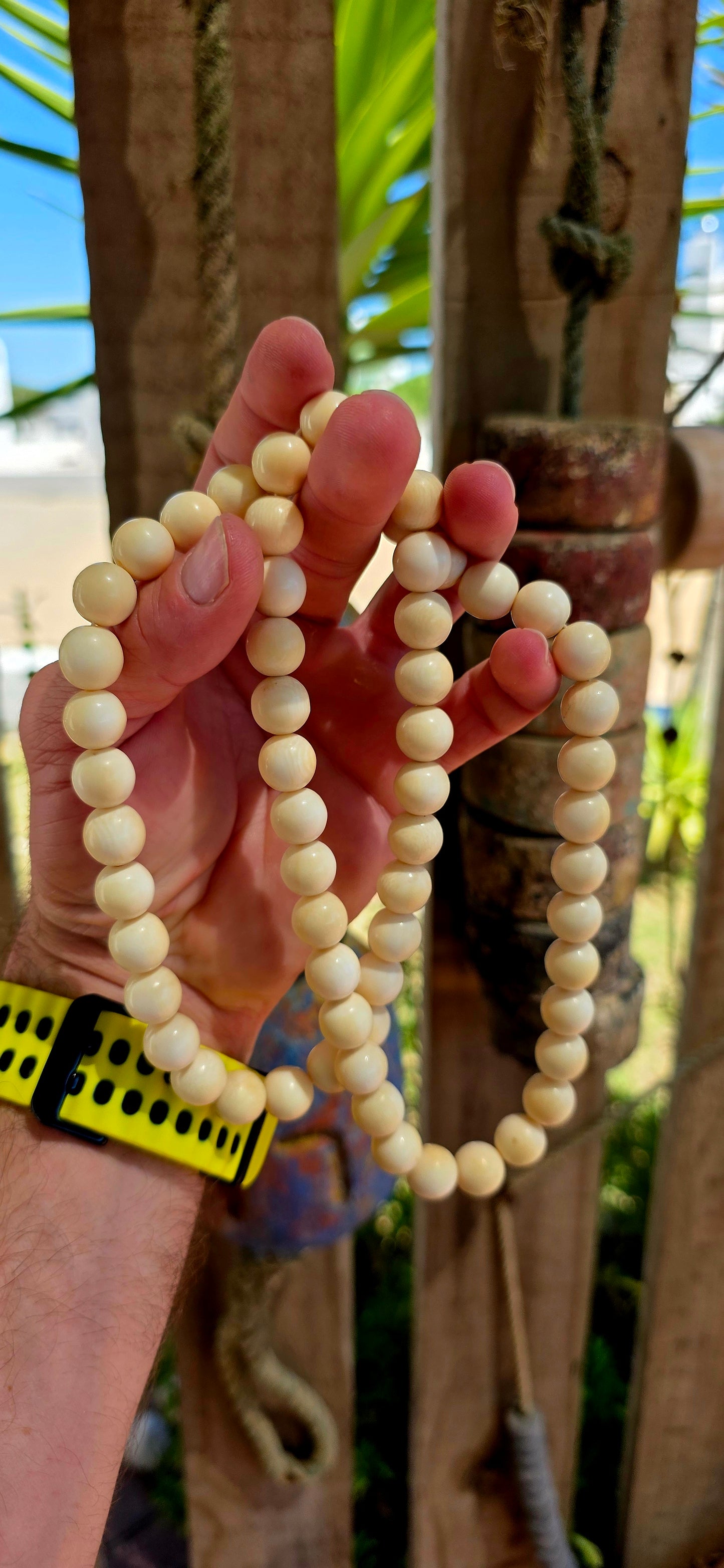 This beautiful antique necklace features a generous strand of perfectly round hand-carved pre-ban ivory beads, forming a timeless and sophisticated piece with remarkable presence.