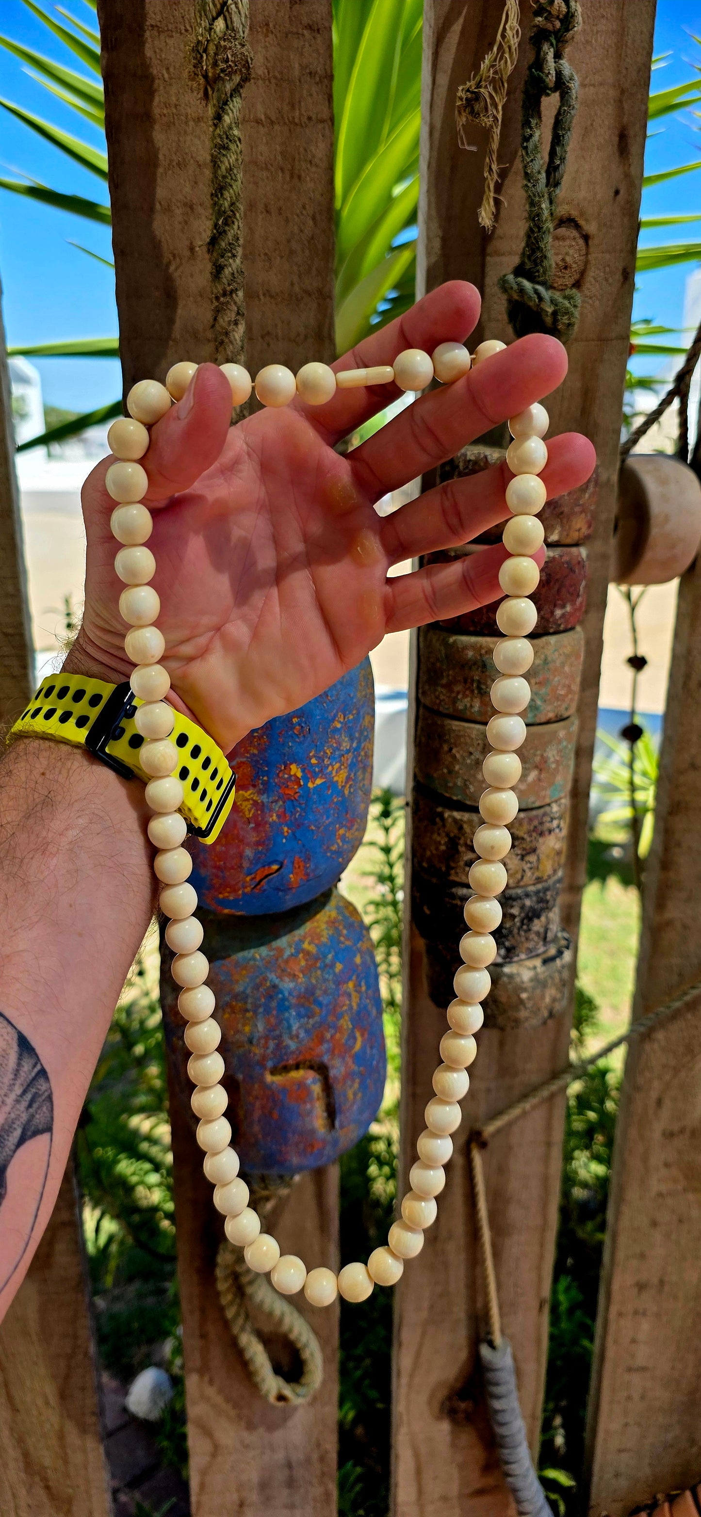 This beautiful antique necklace features a generous strand of perfectly round hand-carved pre-ban ivory beads, forming a timeless and sophisticated piece with remarkable presence.