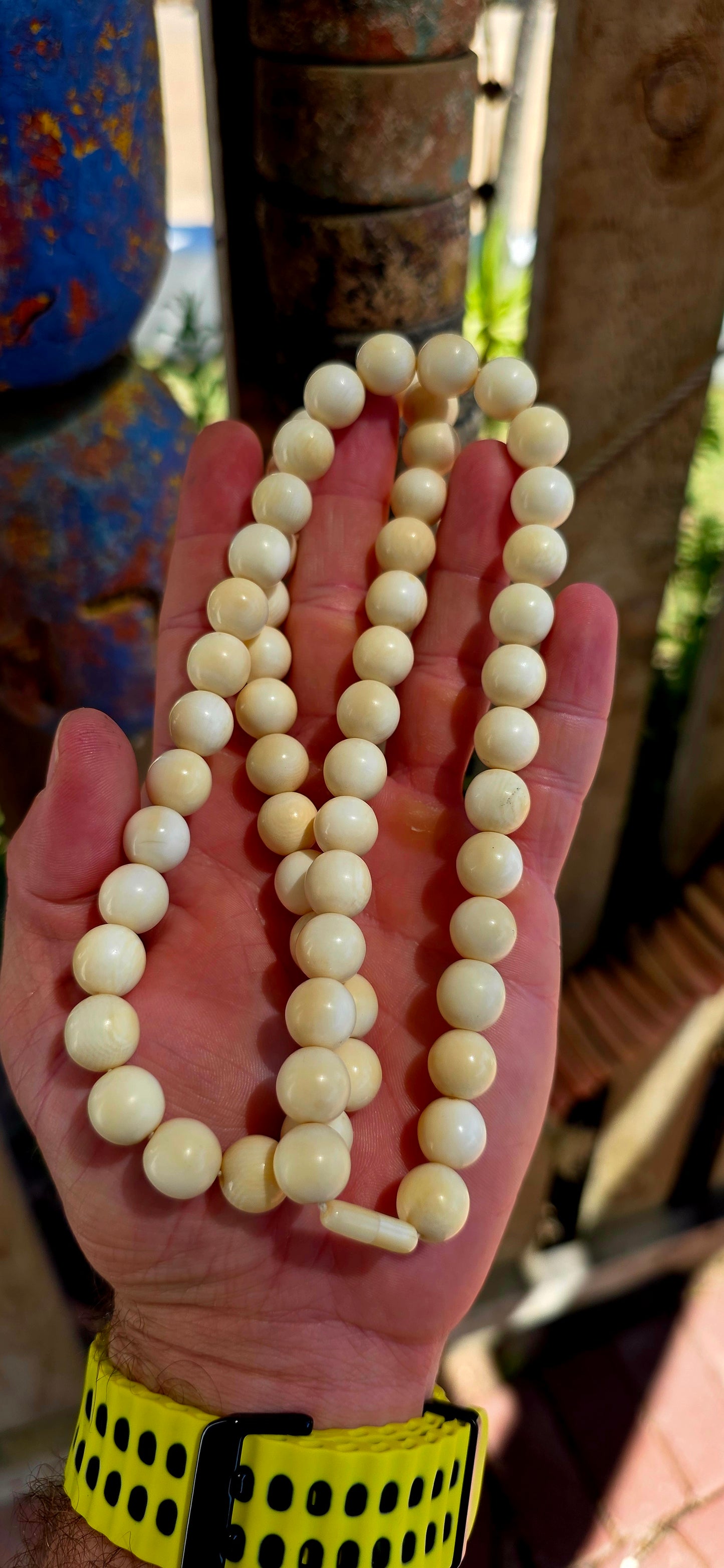 This beautiful antique necklace features a generous strand of perfectly round hand-carved pre-ban ivory beads, forming a timeless and sophisticated piece with remarkable presence.