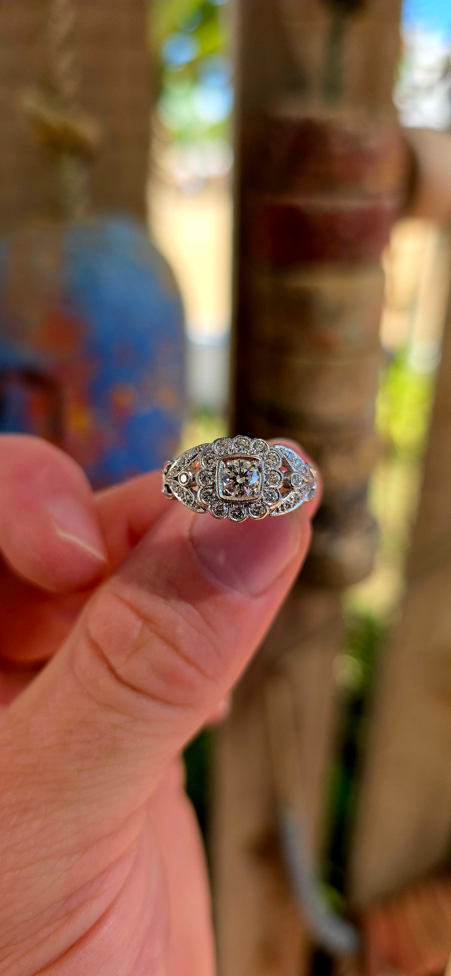 A truly breathtaking example of Art Deco-era elegance, this magnificent antique ring is crafted in solid 18ct white gold and set with an array of ultra-sparkly brilliant white diamonds that capture the light from every angle