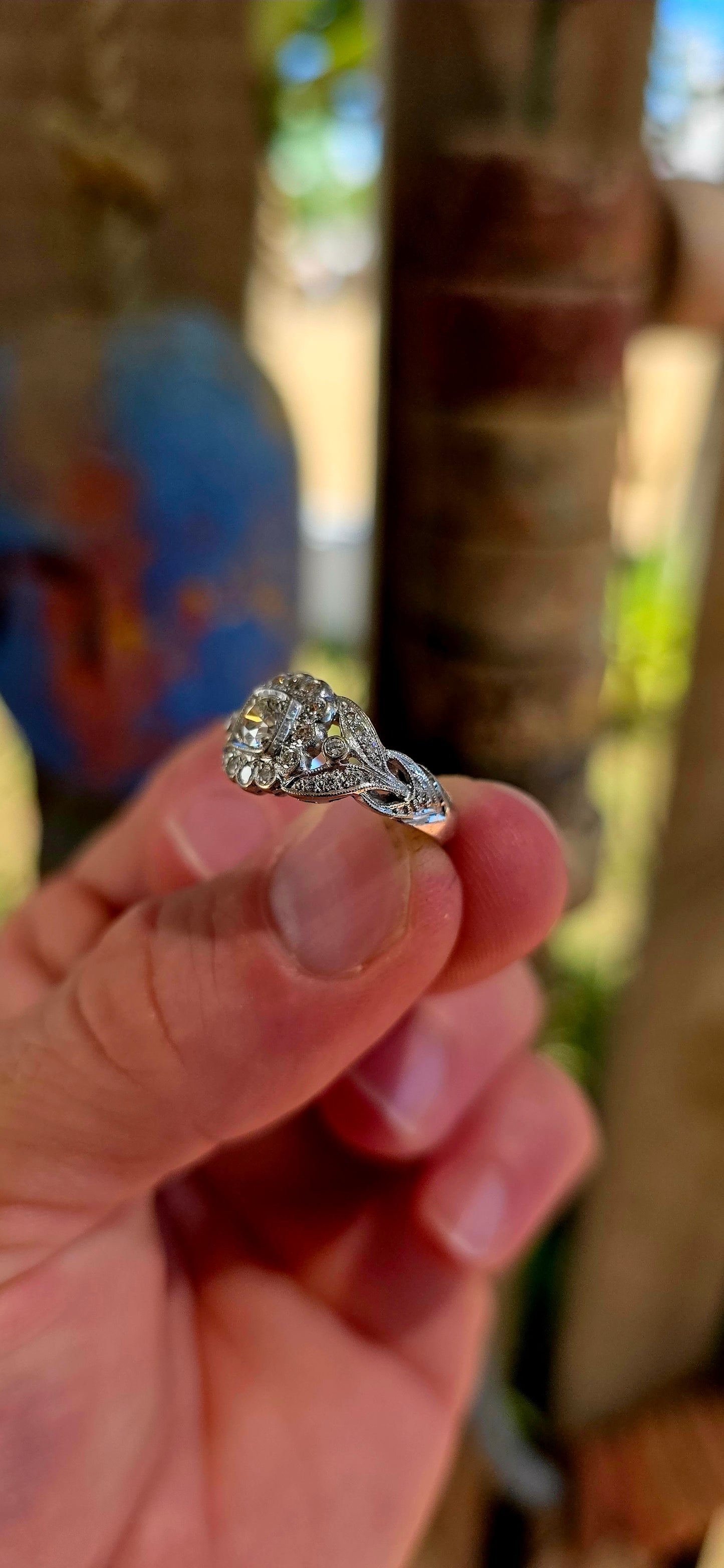 A truly breathtaking example of Art Deco-era elegance, this magnificent antique ring is crafted in solid 18ct white gold and set with an array of ultra-sparkly brilliant white diamonds that capture the light from every angle