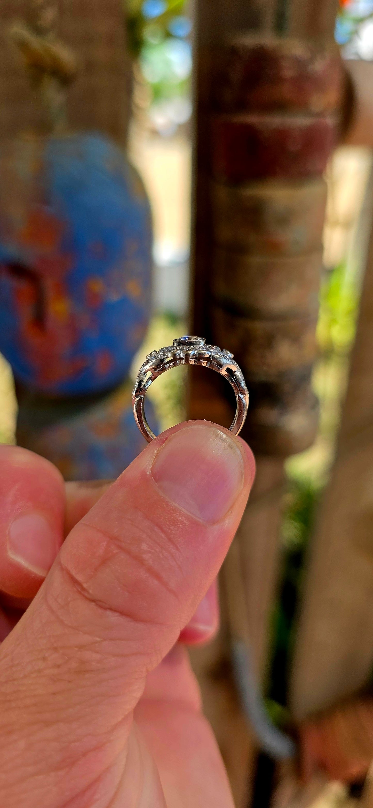 A truly breathtaking example of Art Deco-era elegance, this magnificent antique ring is crafted in solid 18ct white gold and set with an array of ultra-sparkly brilliant white diamonds that capture the light from every angle