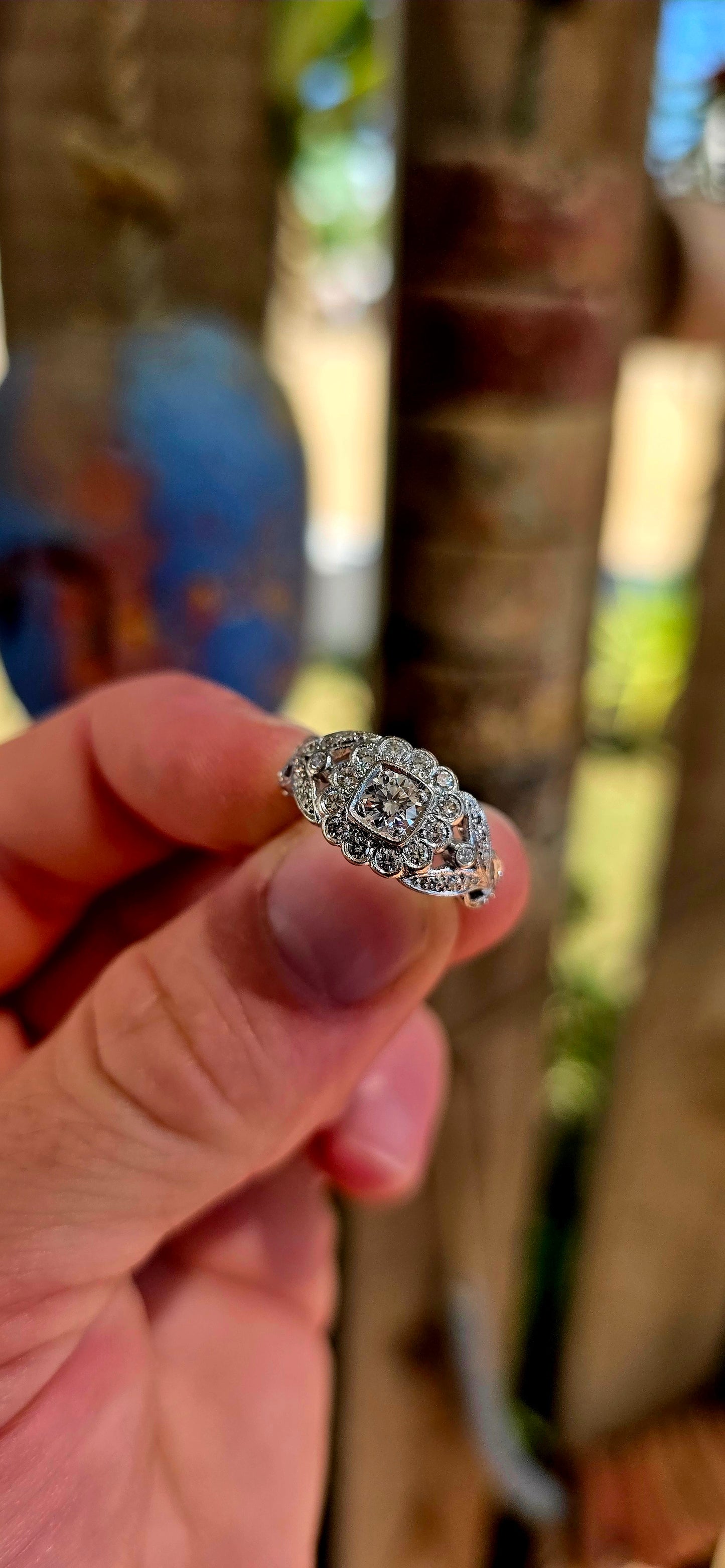 A truly breathtaking example of Art Deco-era elegance, this magnificent antique ring is crafted in solid 18ct white gold and set with an array of ultra-sparkly brilliant white diamonds that capture the light from every angle