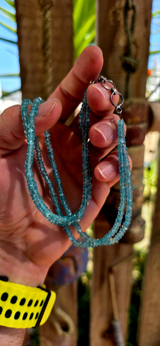 This beautiful necklace is crafted from two strands of faceted blue apatite gemstone beads, each bead cut into tiny rondelles that catch the light with a subtle sparkle.