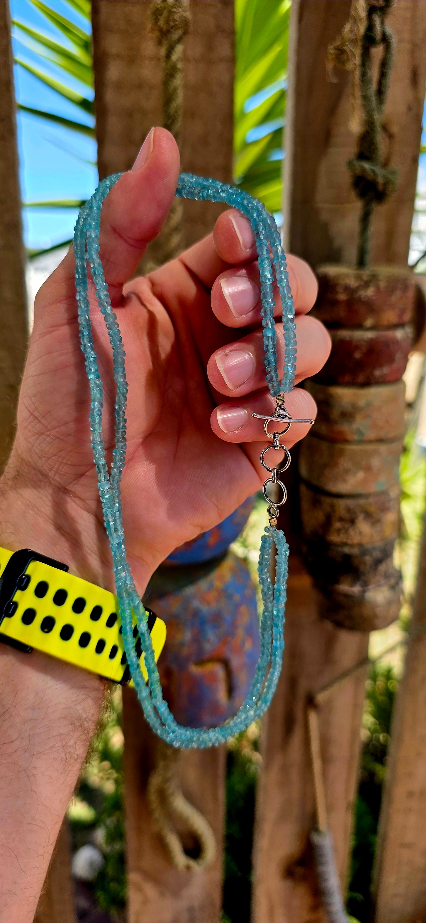 This beautiful necklace is crafted from two strands of faceted blue apatite gemstone beads, each bead cut into tiny rondelles that catch the light with a subtle sparkle.