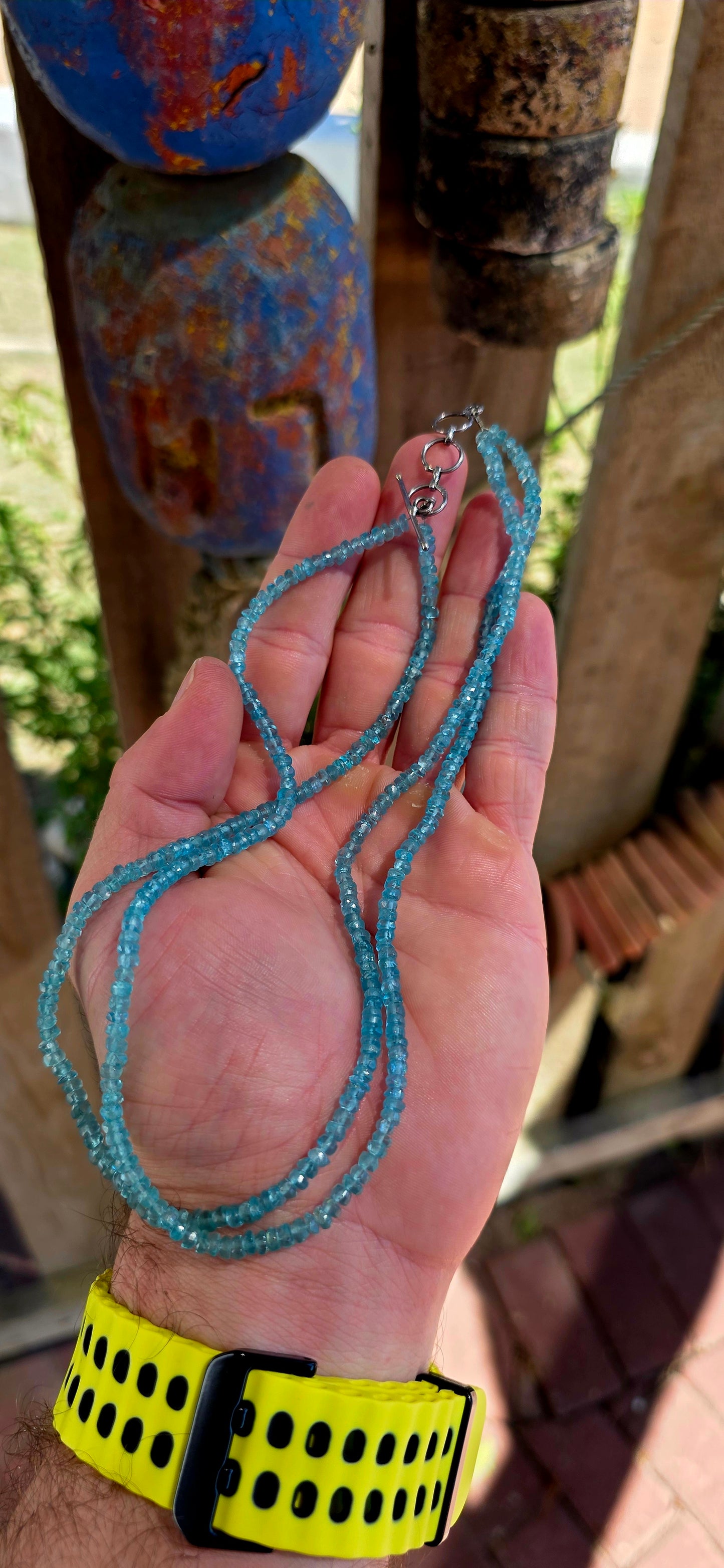 This beautiful necklace is crafted from two strands of faceted blue apatite gemstone beads, each bead cut into tiny rondelles that catch the light with a subtle sparkle.