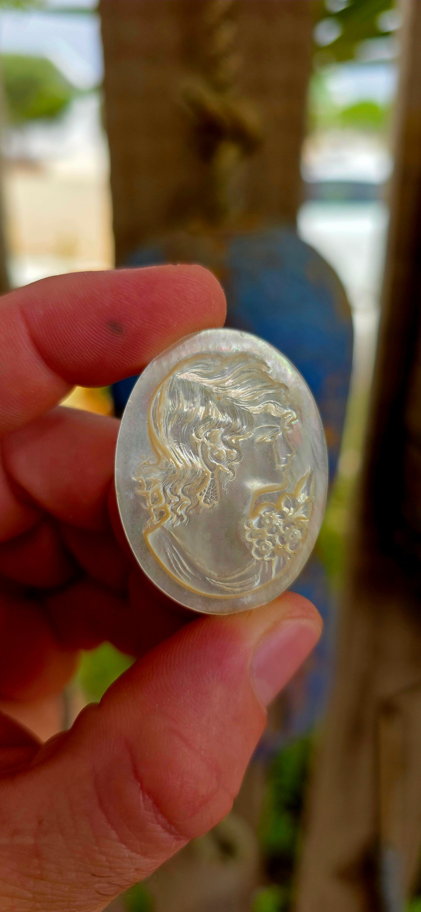 This beautiful vintage cameo is hand carved from luminous mother of pearl, displaying the soft iridescent glow that makes this material so prized in cameo carving.