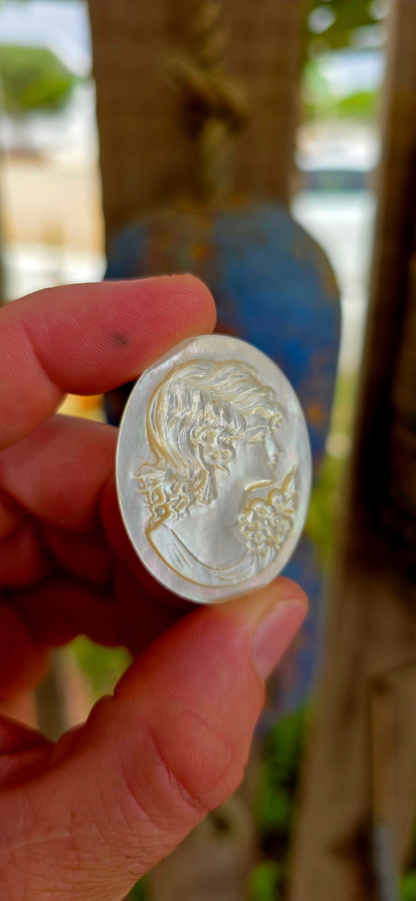 This beautiful vintage cameo is hand carved from luminous mother of pearl, displaying the soft iridescent glow that makes this material so prized in cameo carving.