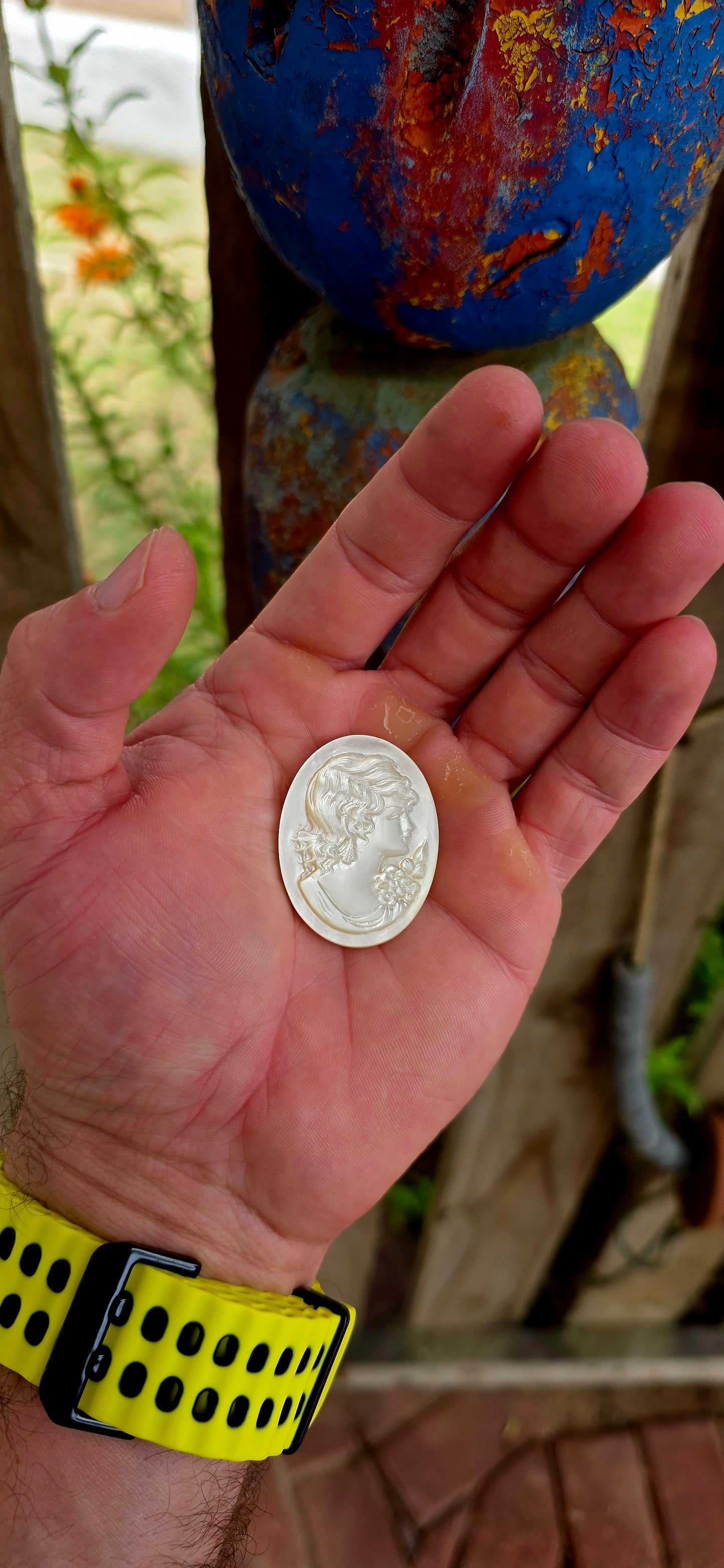 This beautiful vintage cameo is hand carved from luminous mother of pearl, displaying the soft iridescent glow that makes this material so prized in cameo carving.