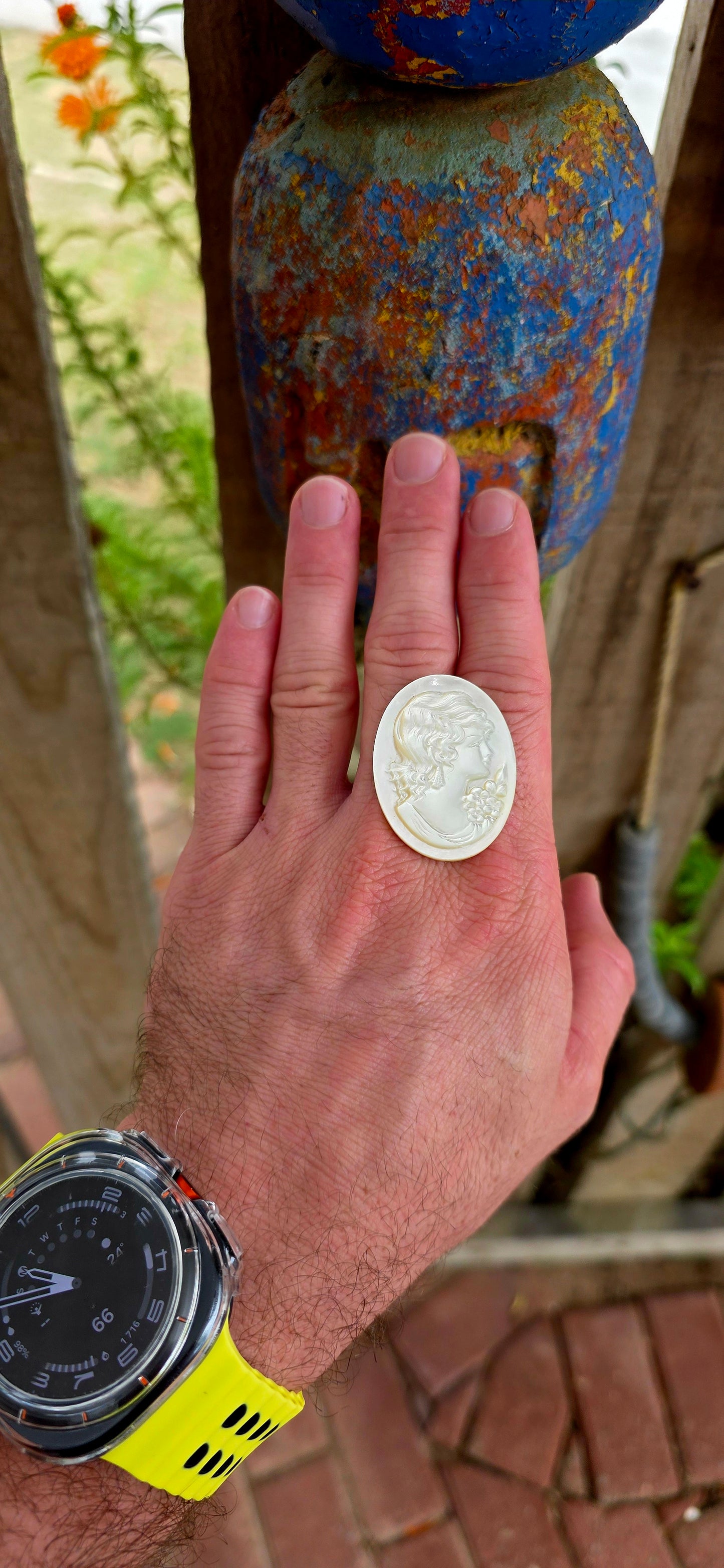 This beautiful vintage cameo is hand carved from luminous mother of pearl, displaying the soft iridescent glow that makes this material so prized in cameo carving.