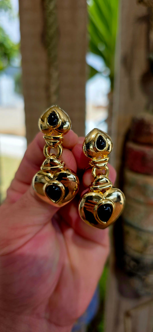 This large and striking pair of vintage 1990’s clip-on earrings captures that unmistakable bold statement style that defined late-20th-century fashion jewellery.