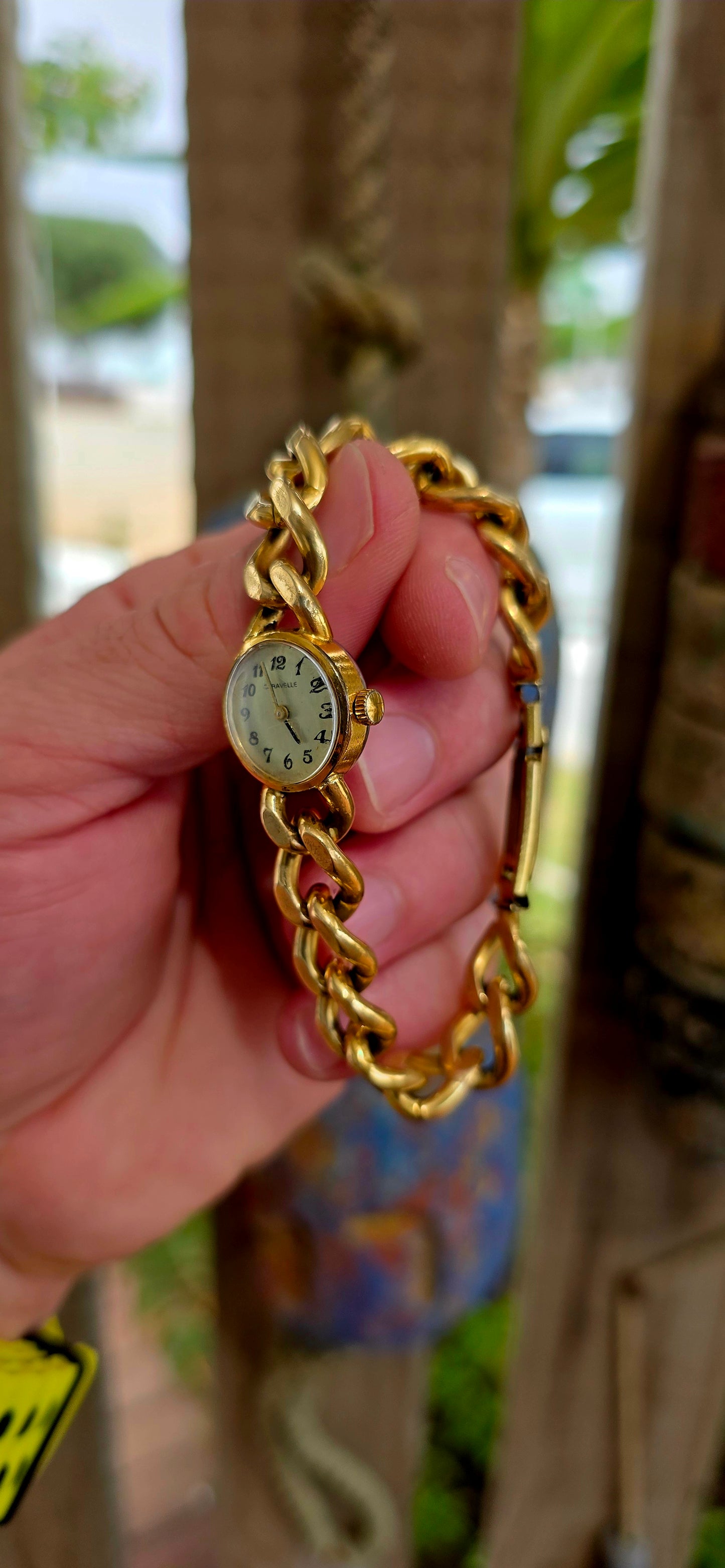 A marvellous vintage Caravelle wristwatch, crafted in yellow gold plating and designed with a bold bracelet-style strap that truly steals the show.