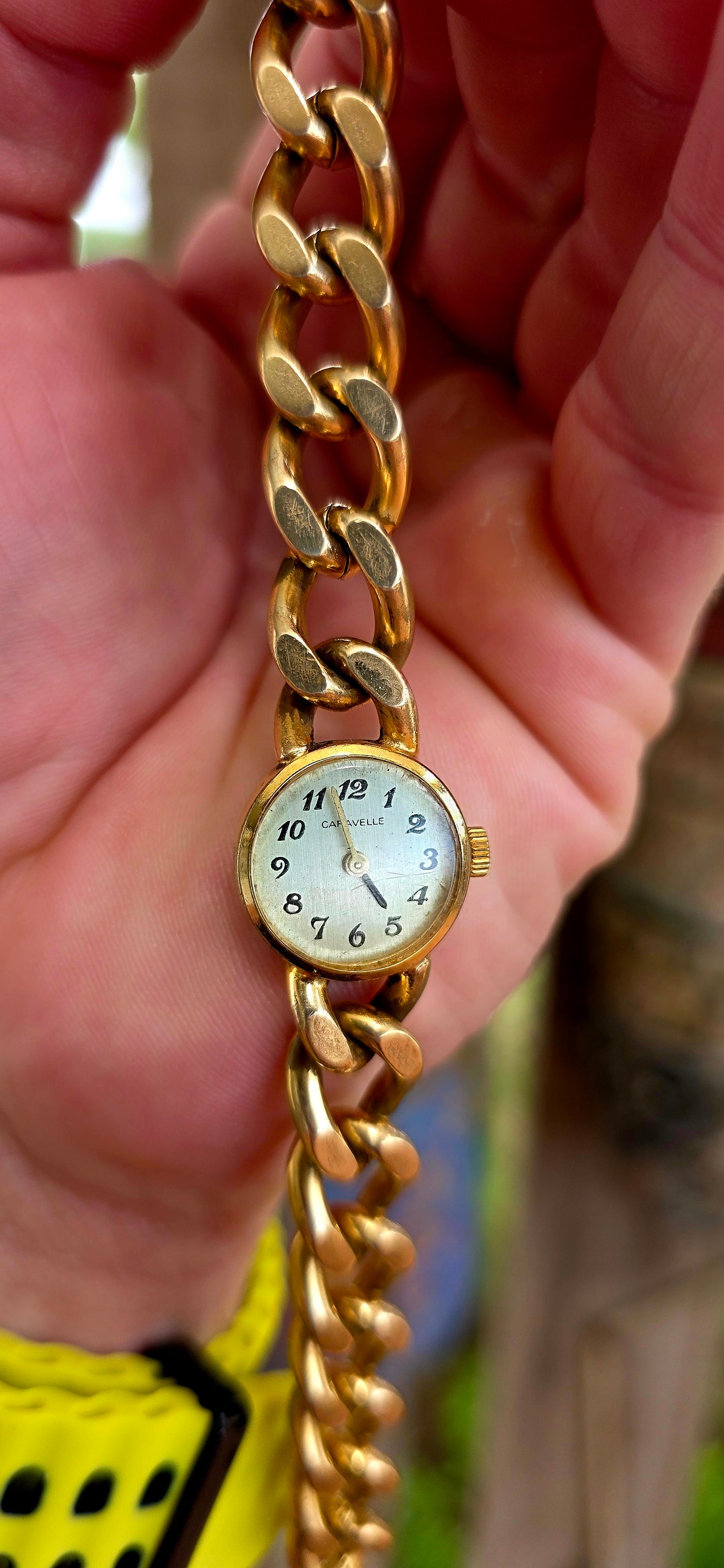 A marvellous vintage Caravelle wristwatch, crafted in yellow gold plating and designed with a bold bracelet-style strap that truly steals the show.