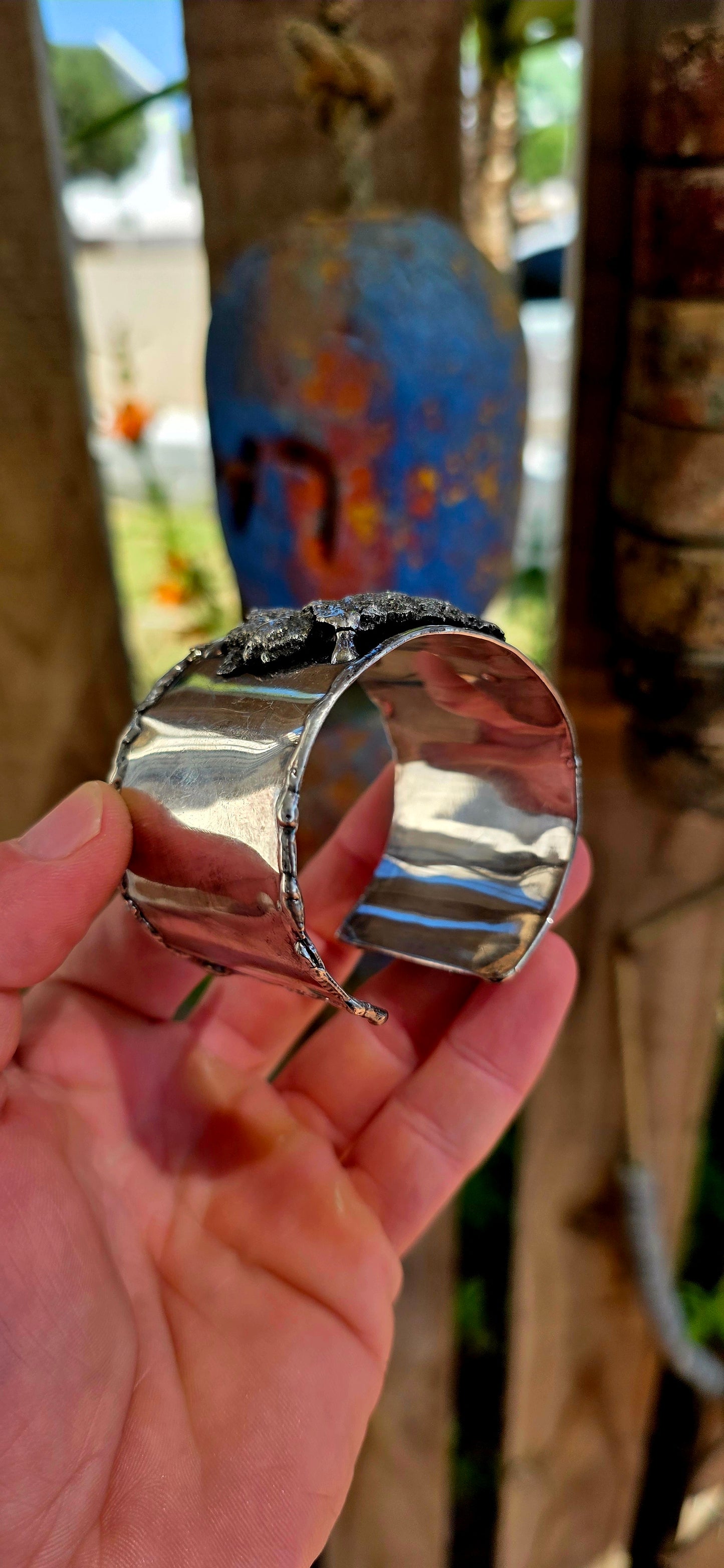 A striking and powerful vintage cuff bangle from the 1970s, crafted in silver-plated metal and embodying the unmistakable spirit of modernist brutalist design—where jewellery becomes wearable sculpture.