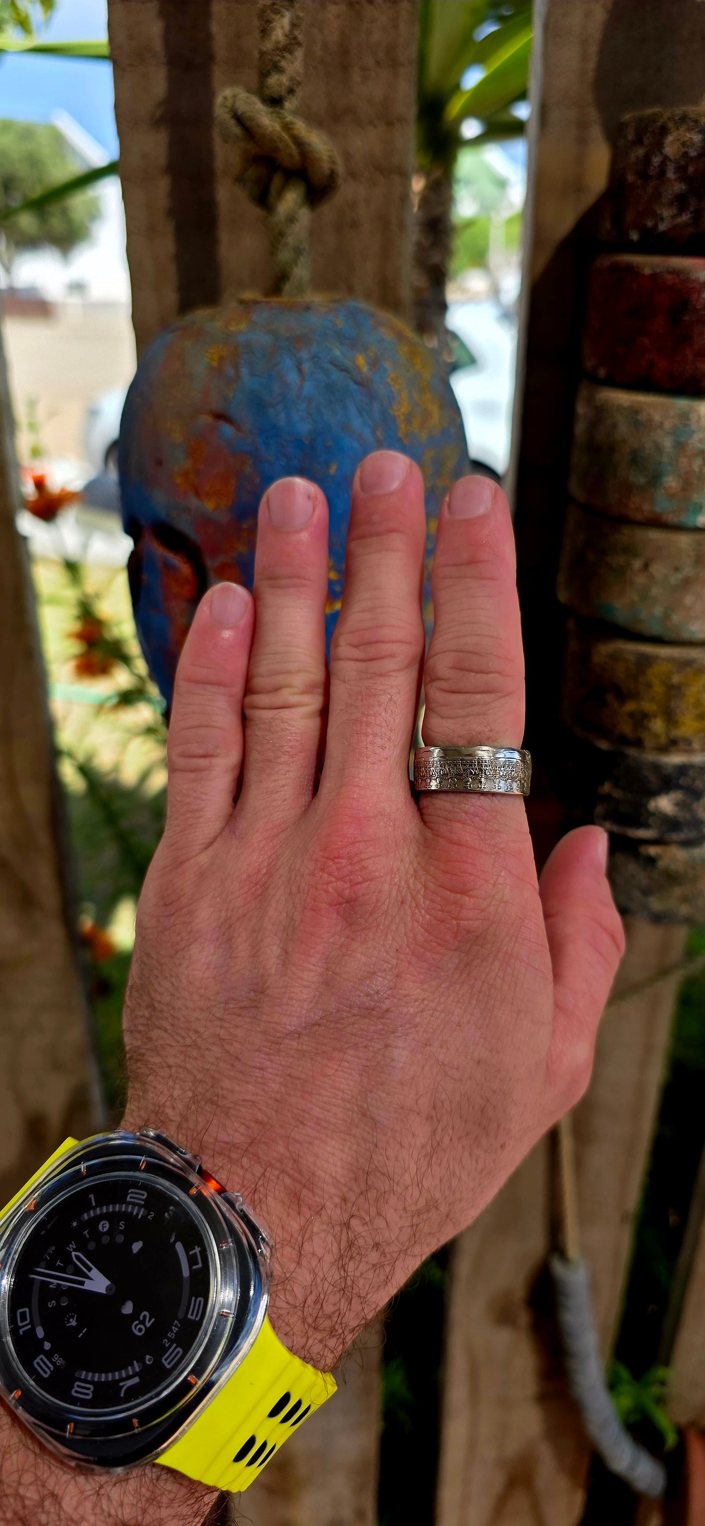 A bold, artisan-crafted coin ring, expertly formed from an authentic 1977 Australian 50 cent coin, struck in nickel and featuring Queen Elizabeth II.