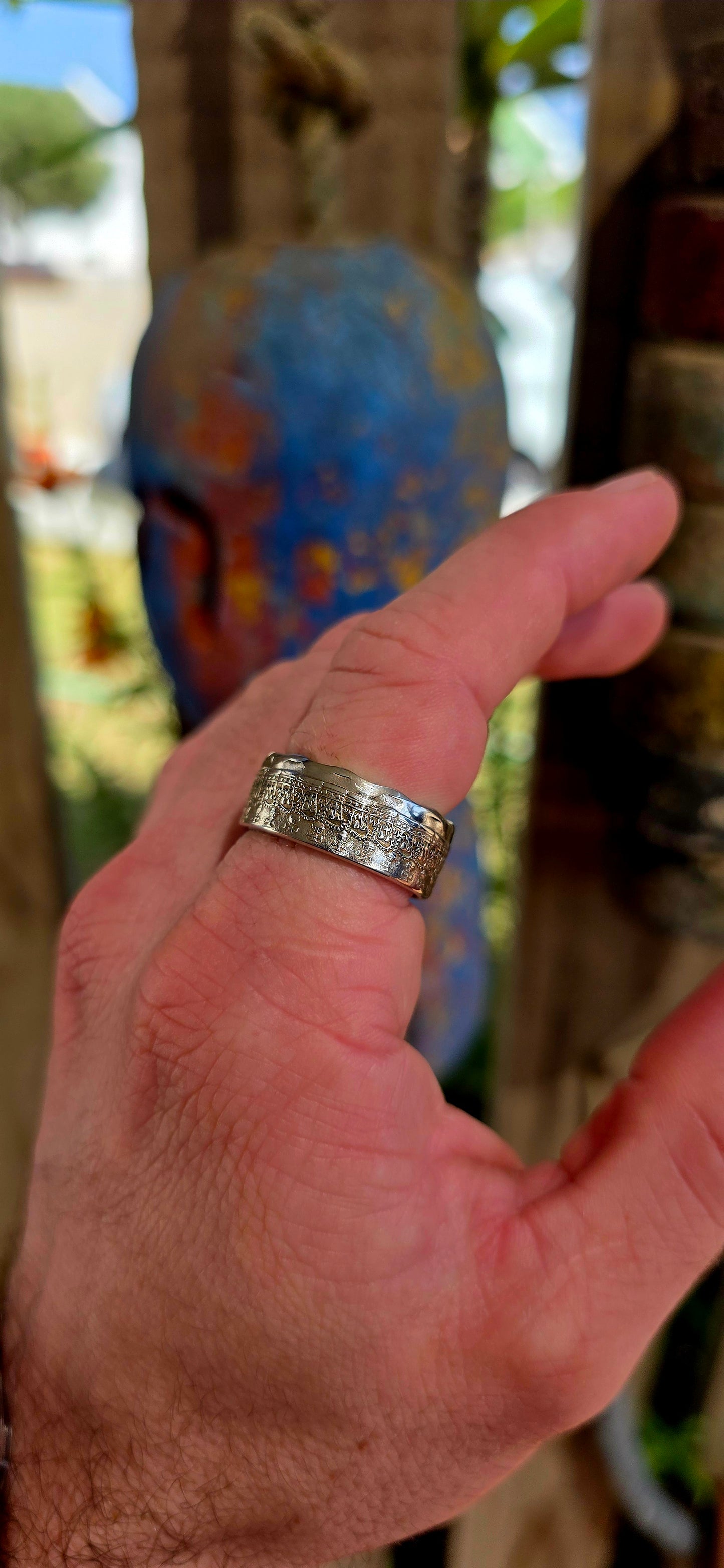 A bold, artisan-crafted coin ring, expertly formed from an authentic 1977 Australian 50 cent coin, struck in nickel and featuring Queen Elizabeth II.