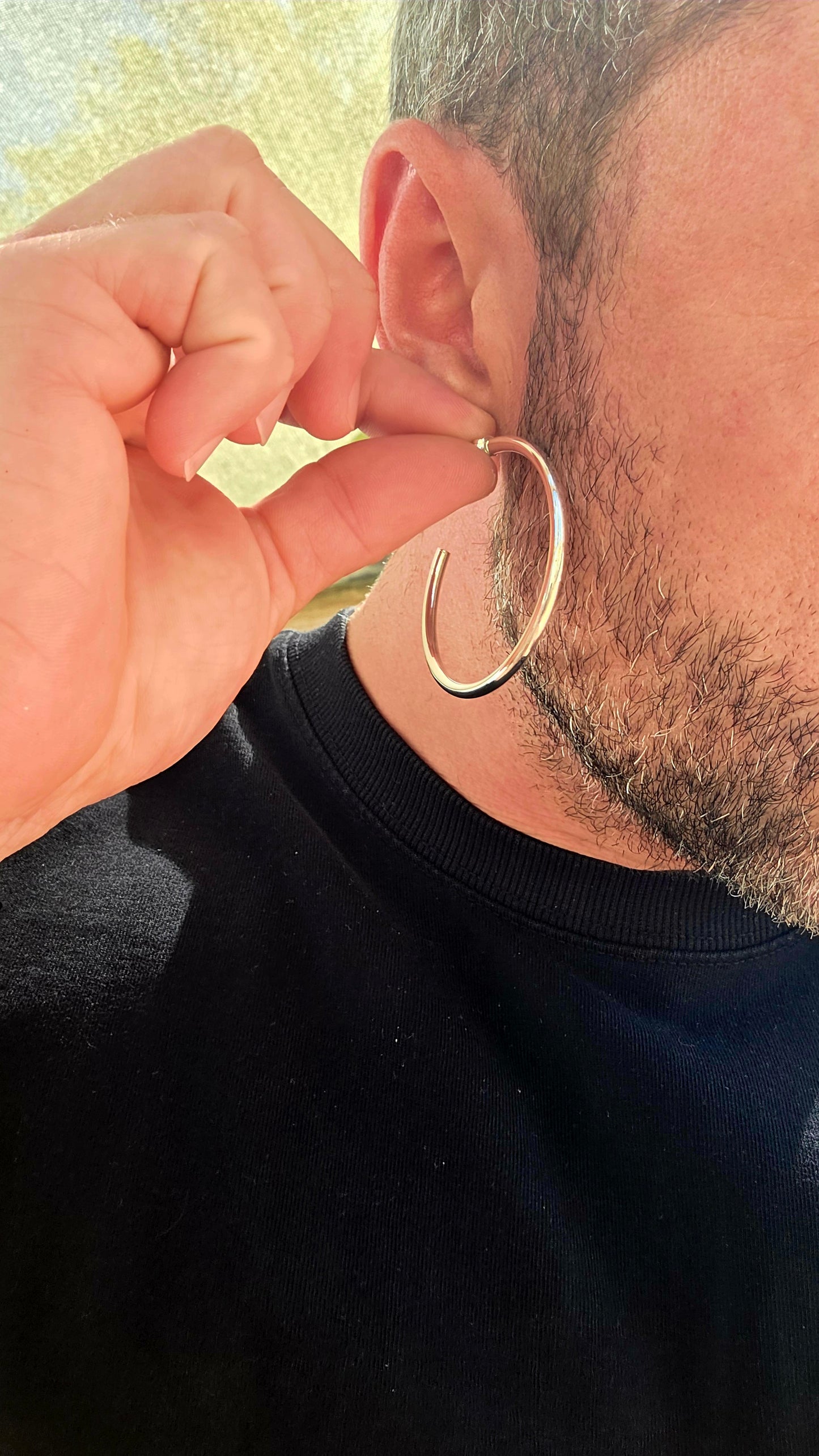 These are proper statement hoops — a generously sized pair crafted in sterling silver, designed in a classic round tubular (hollow) form that gives you that big, bold look without the heavy weight.