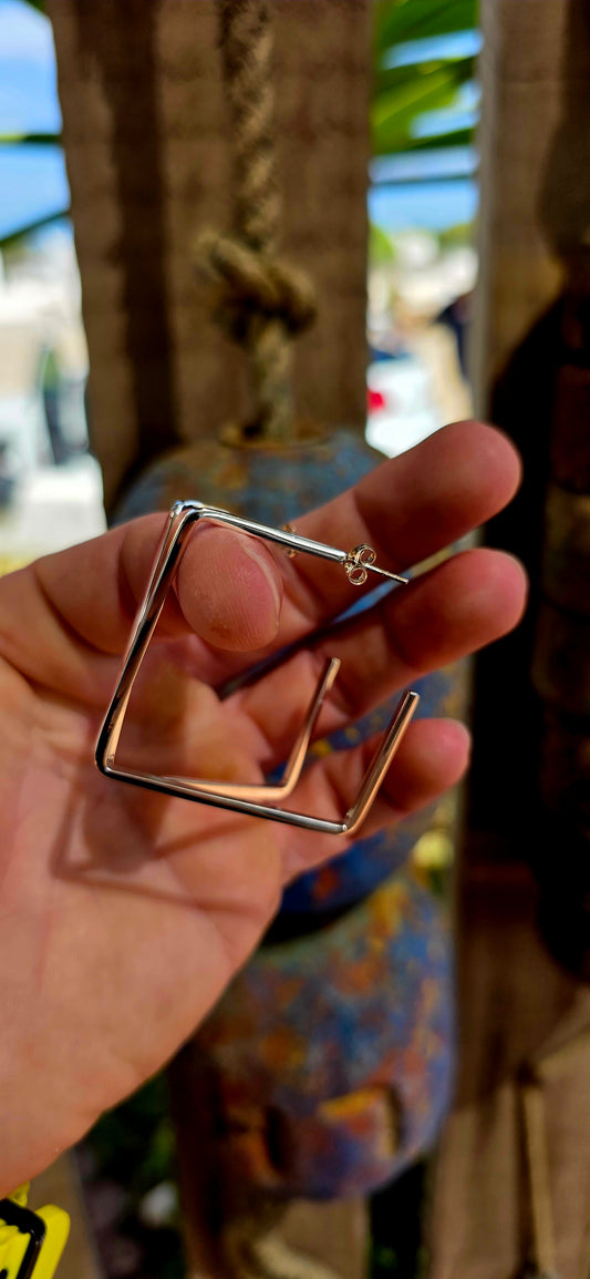 A striking pair of modernist statement hoo0 earrings, crafted in solid sterling silver and designed in a bold geometric square silhouette — clean lines, strong angles, and serious presence.