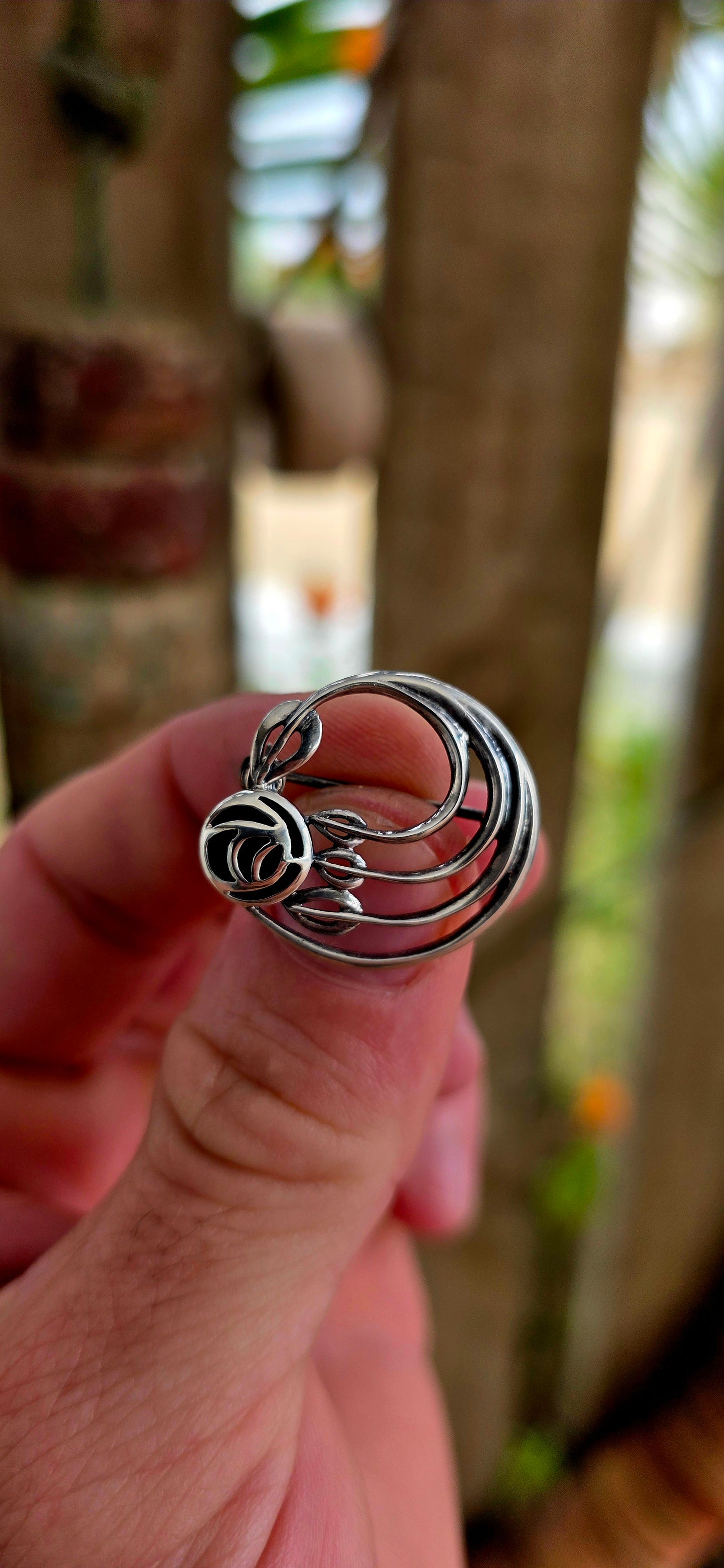A pretty and petite vintage designer brooch, crafted in solid sterling silver and set with black onyx, created by renowned British jewellery house Kit Heath circa 1995.