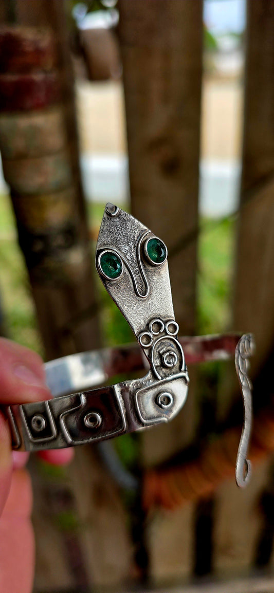A striking and sculptural vintage Egyptian Revival serpent cuff, crafted in solid sterling silver, designed to wrap boldly around the upper arm or wrist as a true statement of strength and symbolism.