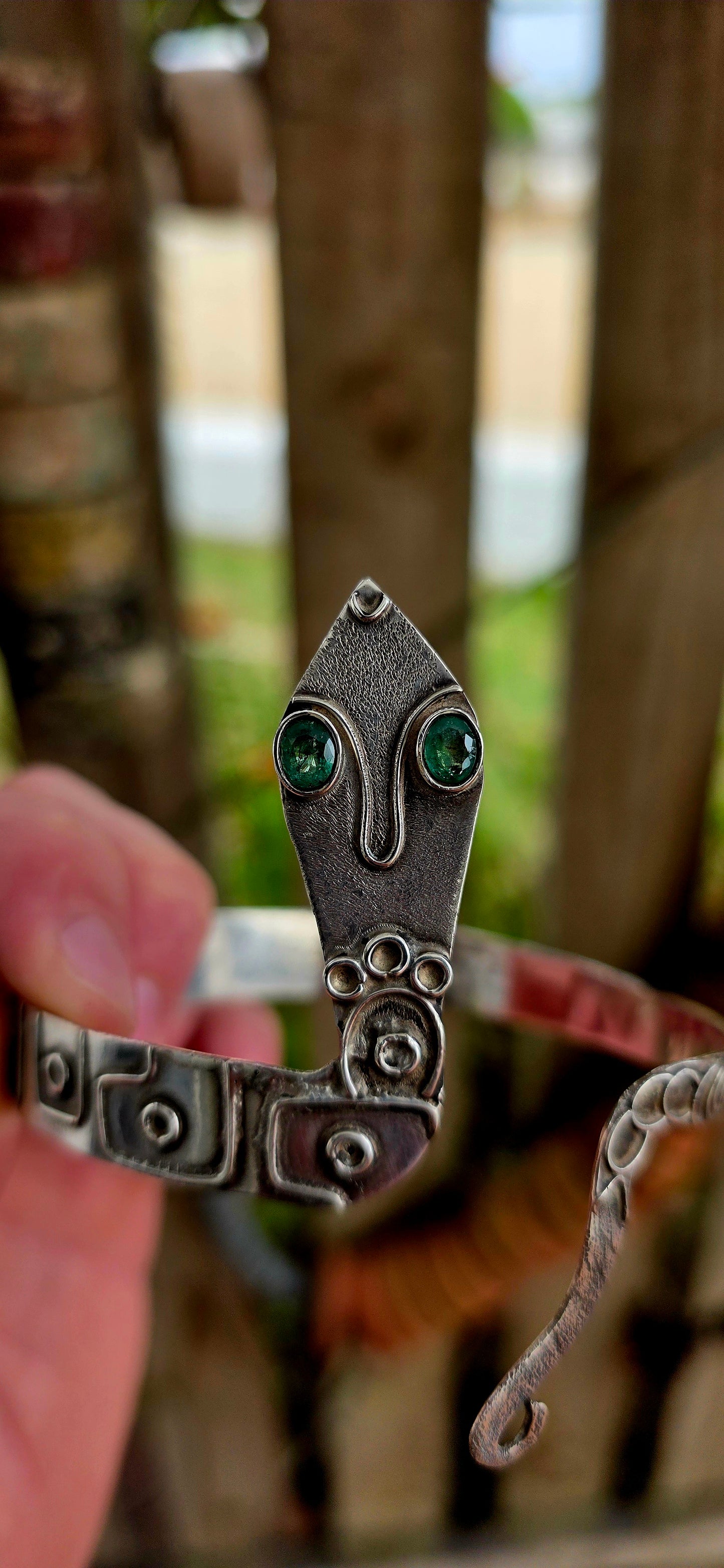 A striking and sculptural vintage Egyptian Revival serpent cuff, crafted in solid sterling silver, designed to wrap boldly around the upper arm or wrist as a true statement of strength and symbolism.