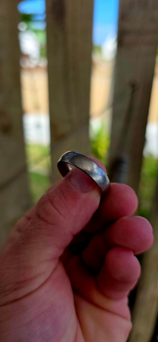 A sleek, mens titanium band ring by renowned South African luxury jeweller Arthur Kaplan — the kind of piece that leans into quiet confidence and everyday power.