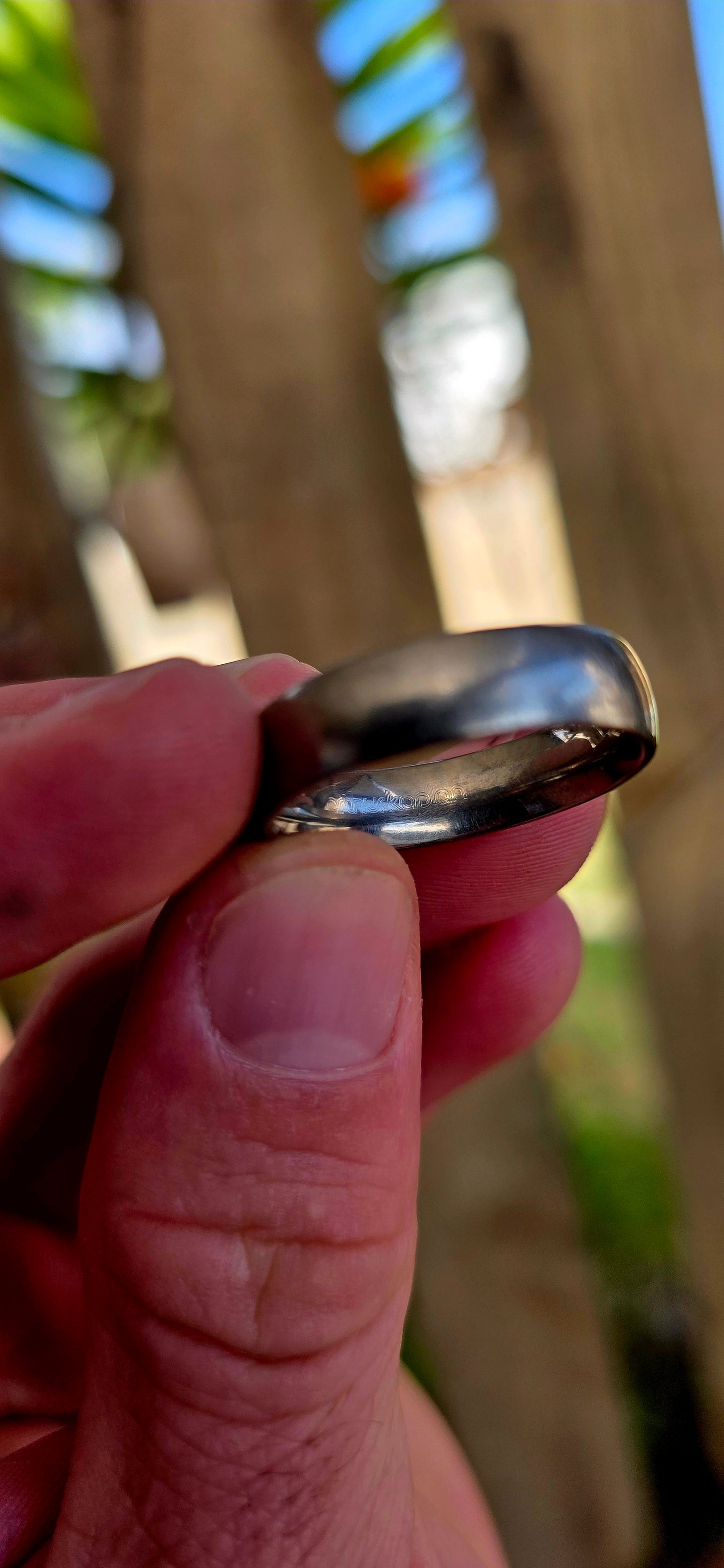 A sleek, mens titanium band ring by renowned South African luxury jeweller Arthur Kaplan — the kind of piece that leans into quiet confidence and everyday power.