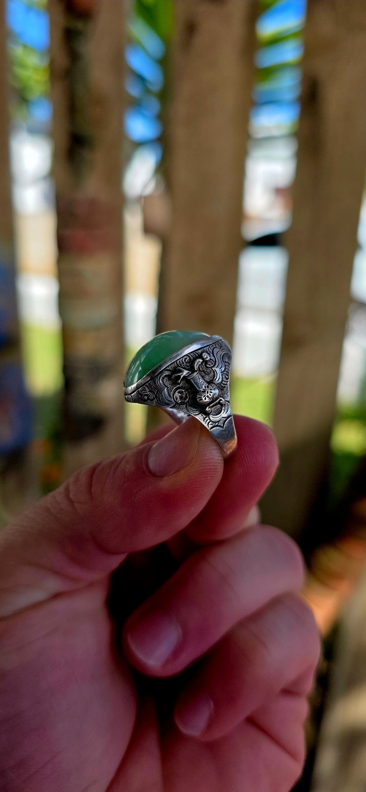 A rare antique Chinese export sterling silver statement ring, crowned with a beautifully smooth apple-green jade cabochon.
