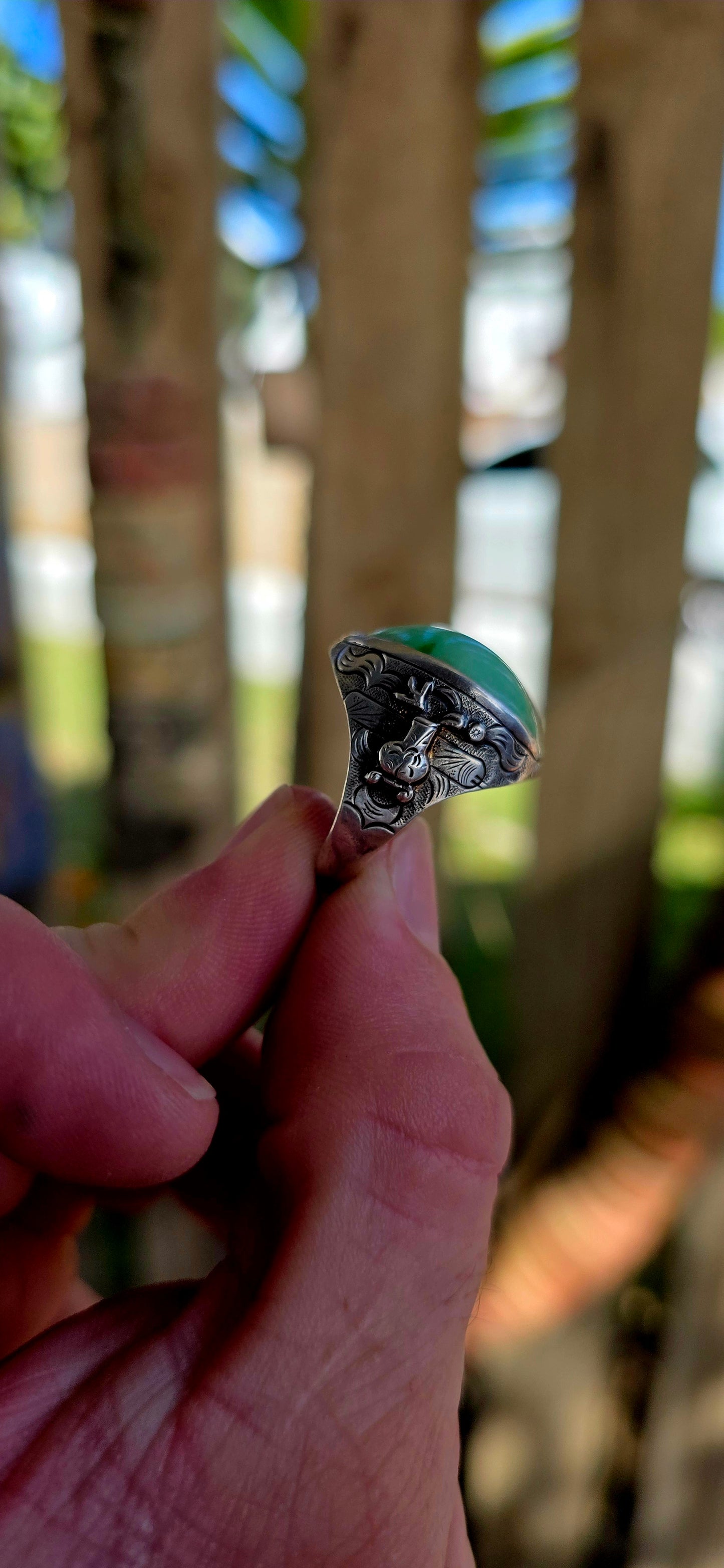 A rare antique Chinese export sterling silver statement ring, crowned with a beautifully smooth apple-green jade cabochon.