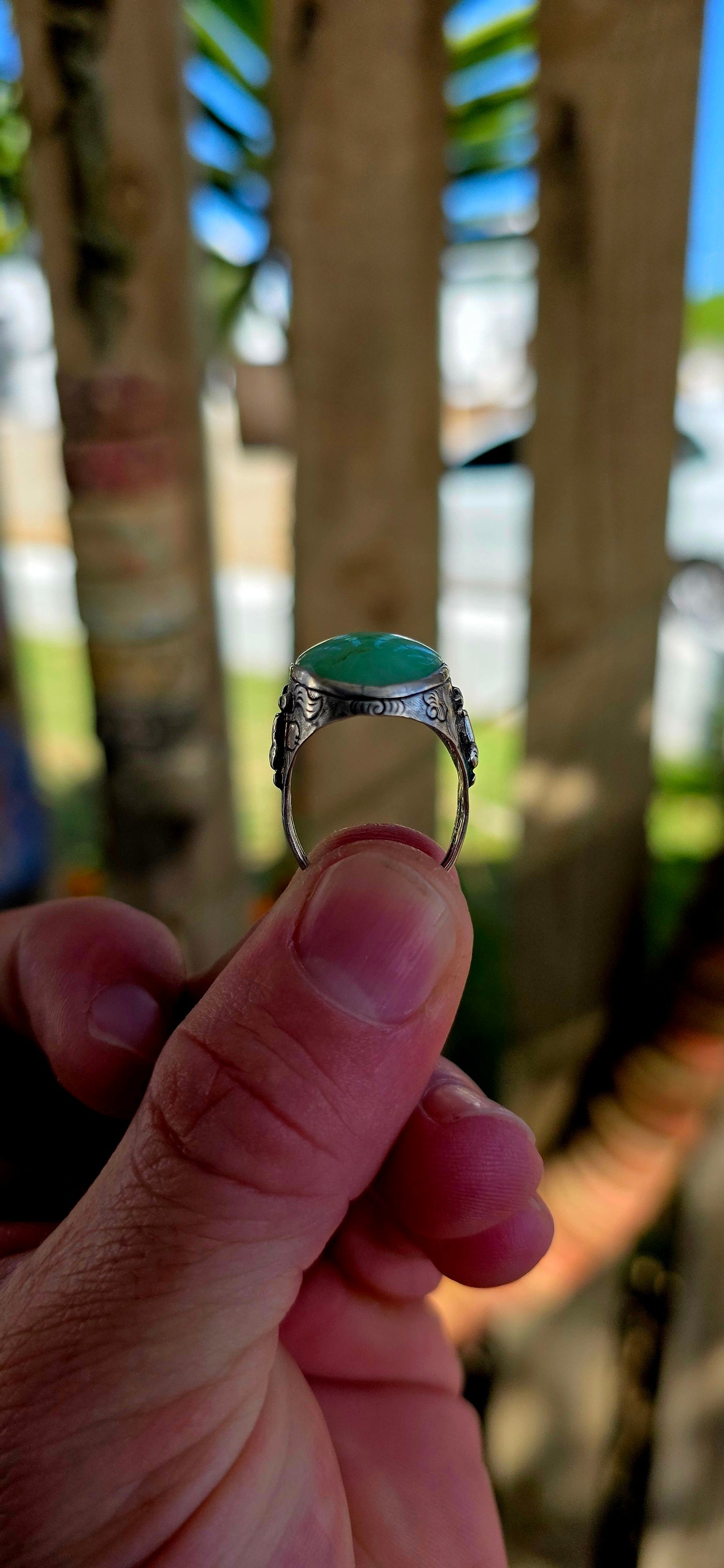 A rare antique Chinese export sterling silver statement ring, crowned with a beautifully smooth apple-green jade cabochon.