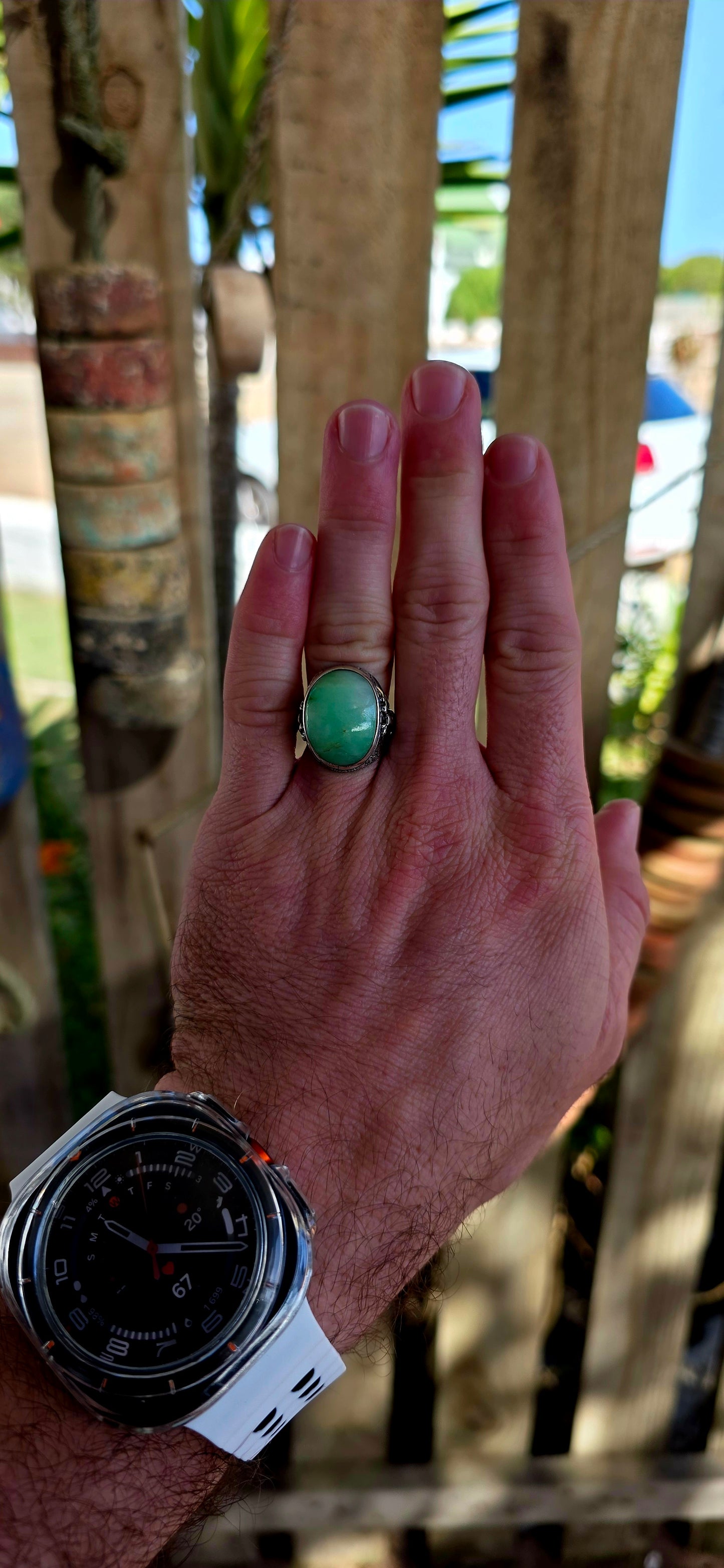 A rare antique Chinese export sterling silver statement ring, crowned with a beautifully smooth apple-green jade cabochon.