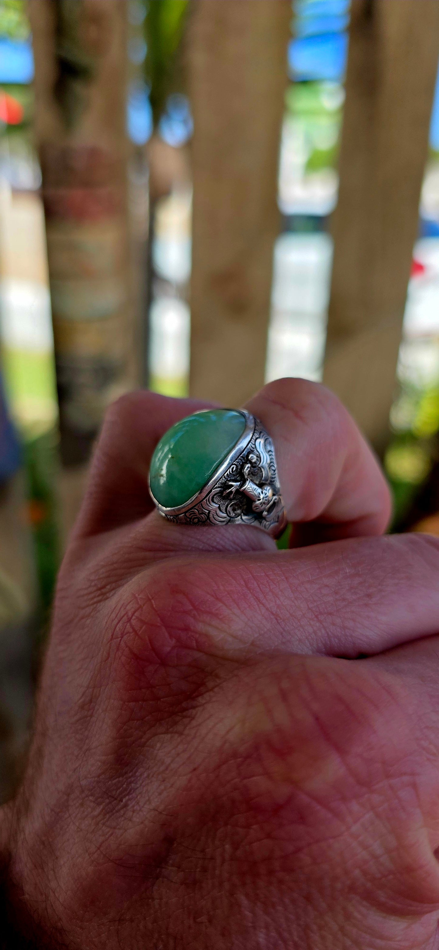 A rare antique Chinese export sterling silver statement ring, crowned with a beautifully smooth apple-green jade cabochon.
